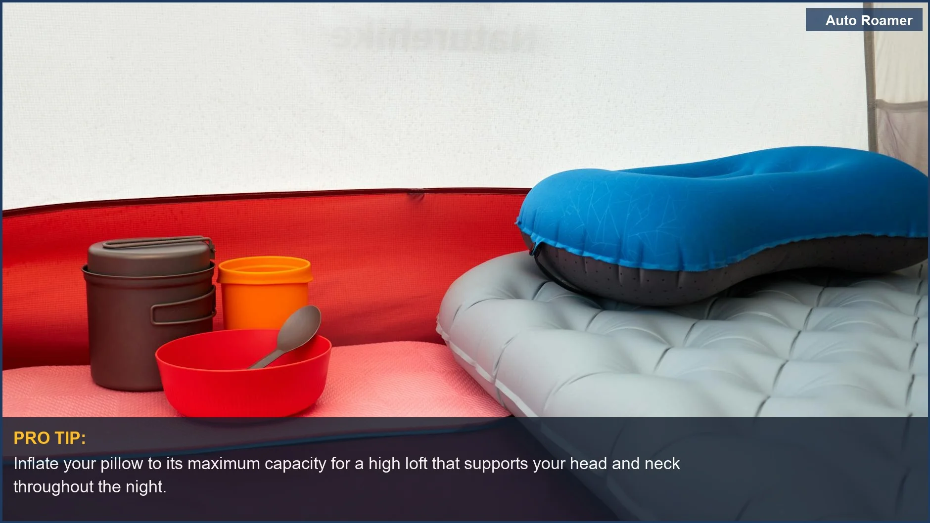 Inside a tent with an inflatable pillow, cookware, and sleeping pad, emphasizing the need for a high loft pillow for car camping.