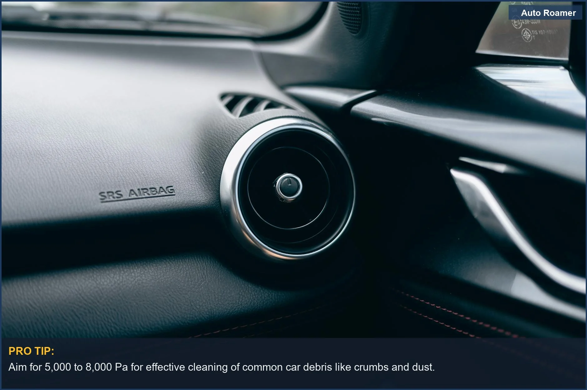 Close-up of car dashboard with air vent, illustrating the importance of portable car vacuum suction power for detailed cleaning.