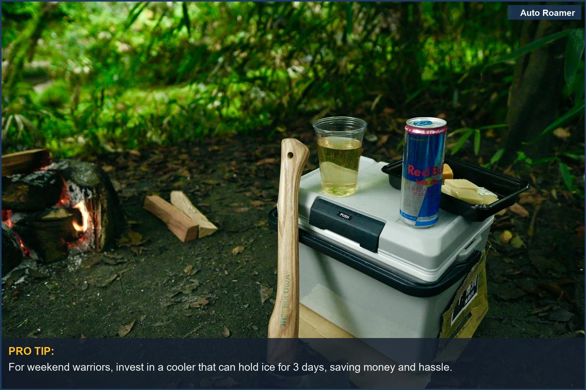 Serene campsite with axe, fire, and car camping cooler for outdoor adventures.
