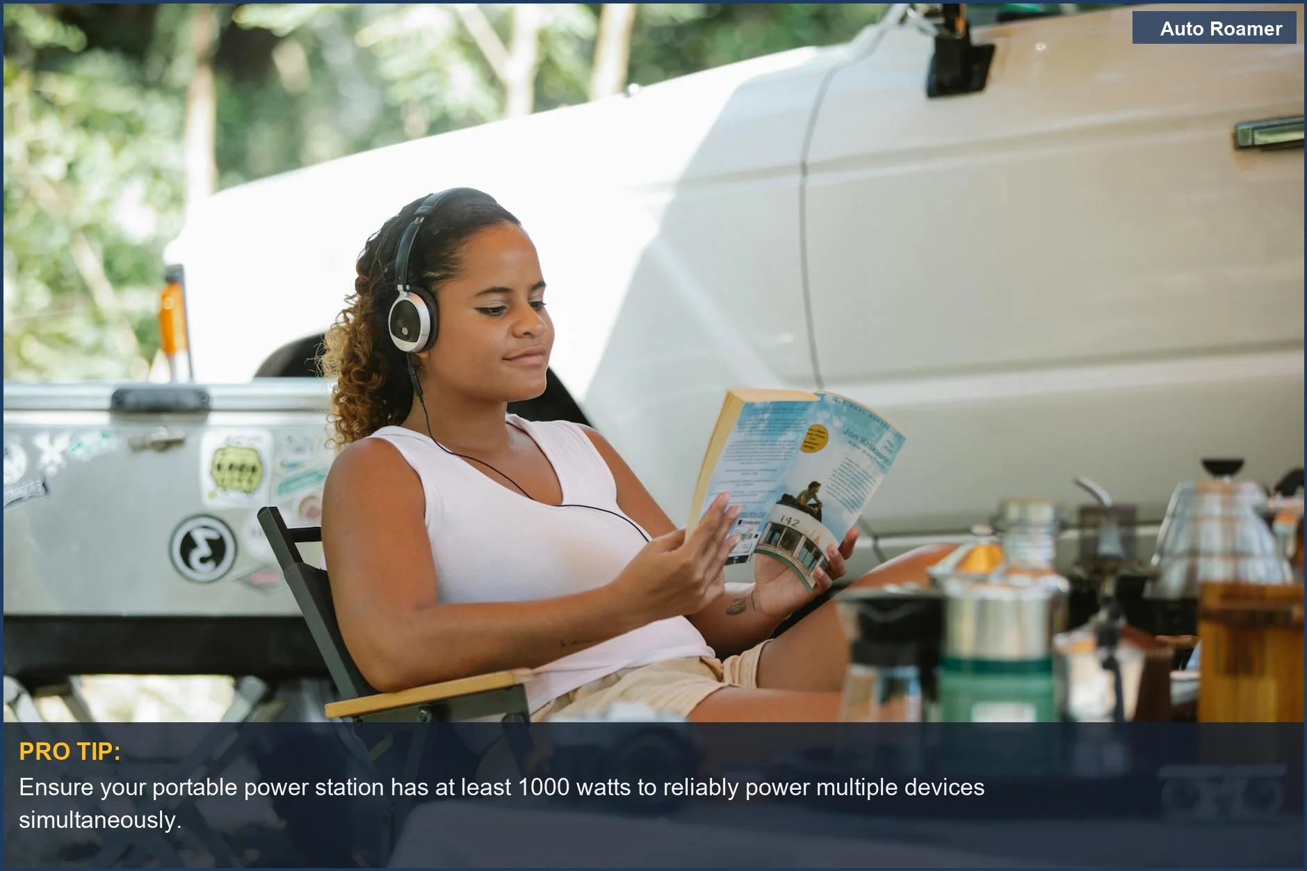 Woman enjoying music with a portable power station for SUV camping next to her vehicle.
