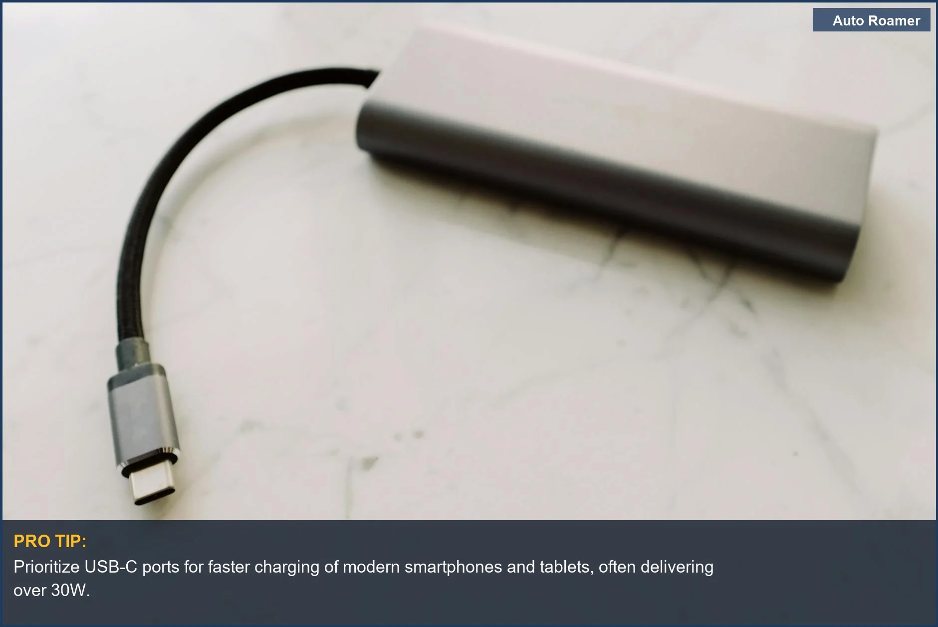 Close-up view of a sleek USB-C charging port on a marble surface, highlighting versatile USB charging ports.