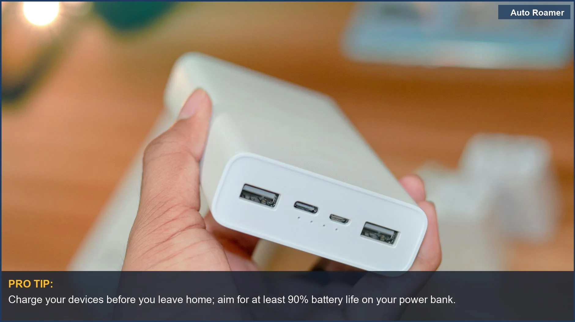 Hand holding a portable power bank with multiple USB ports, perfect for car camping power tools.