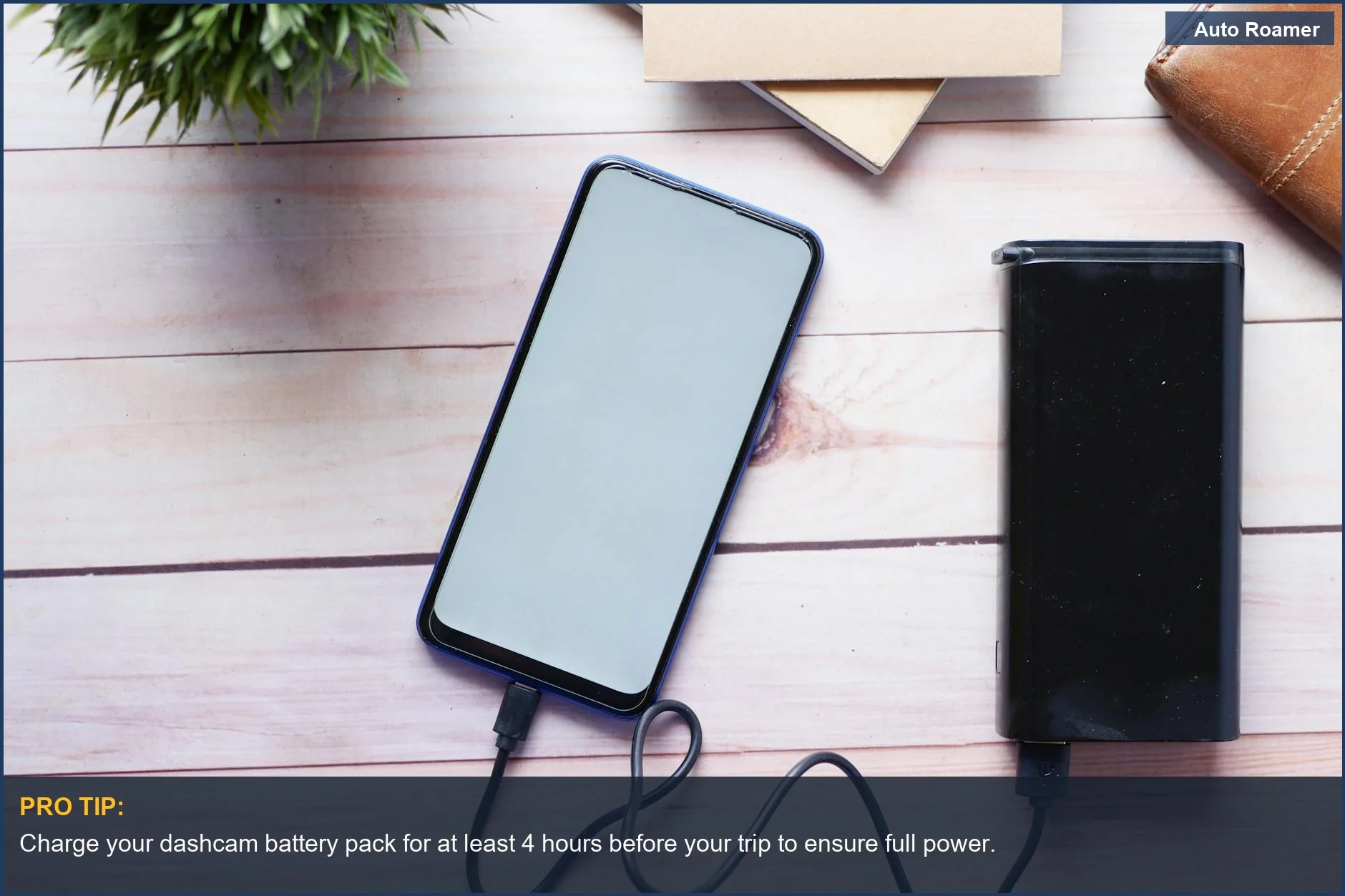 Power bank charging a smartphone, essential for hidden dashcam power car camping setups.