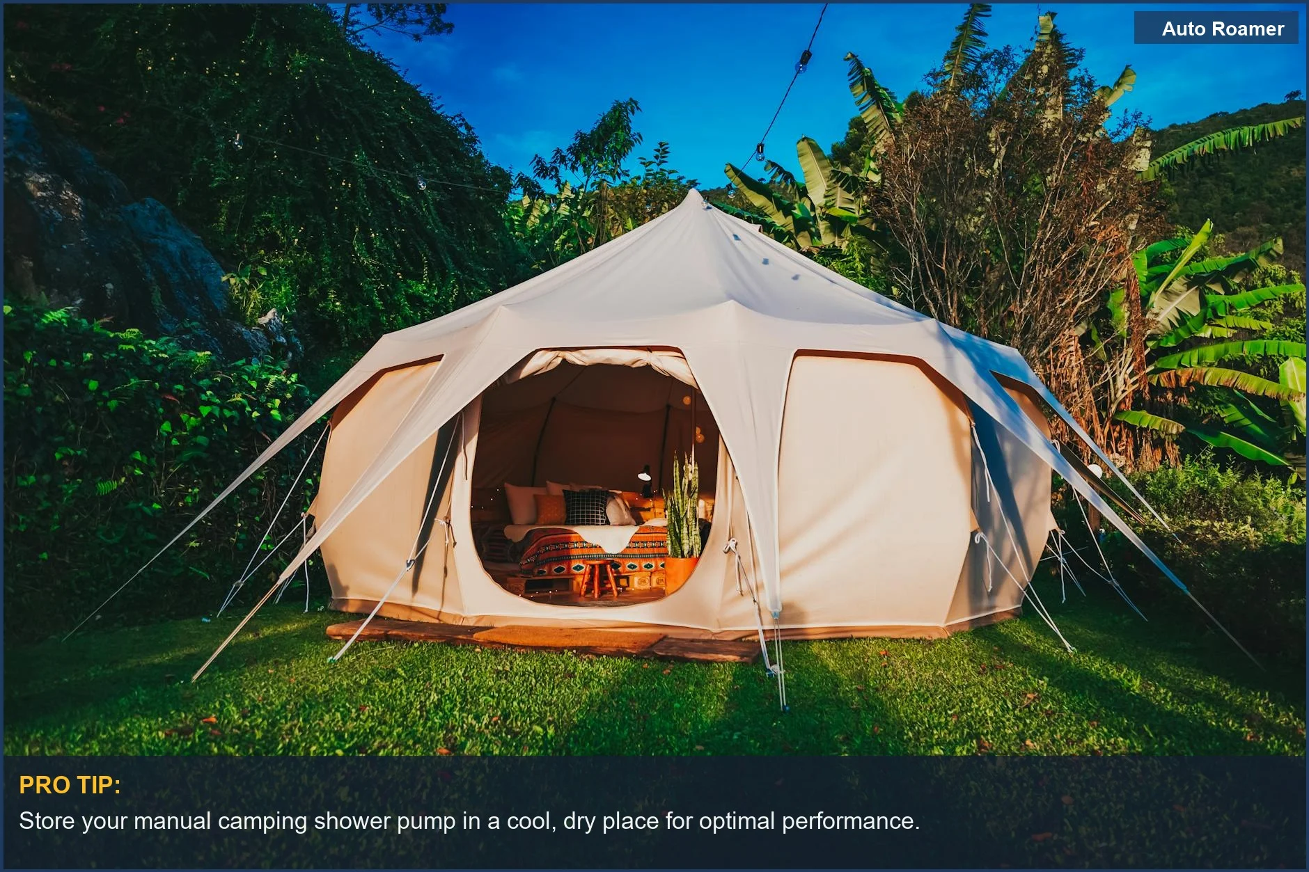 Spacious glamping tent with an outdoor shower setup in a vibrant garden.