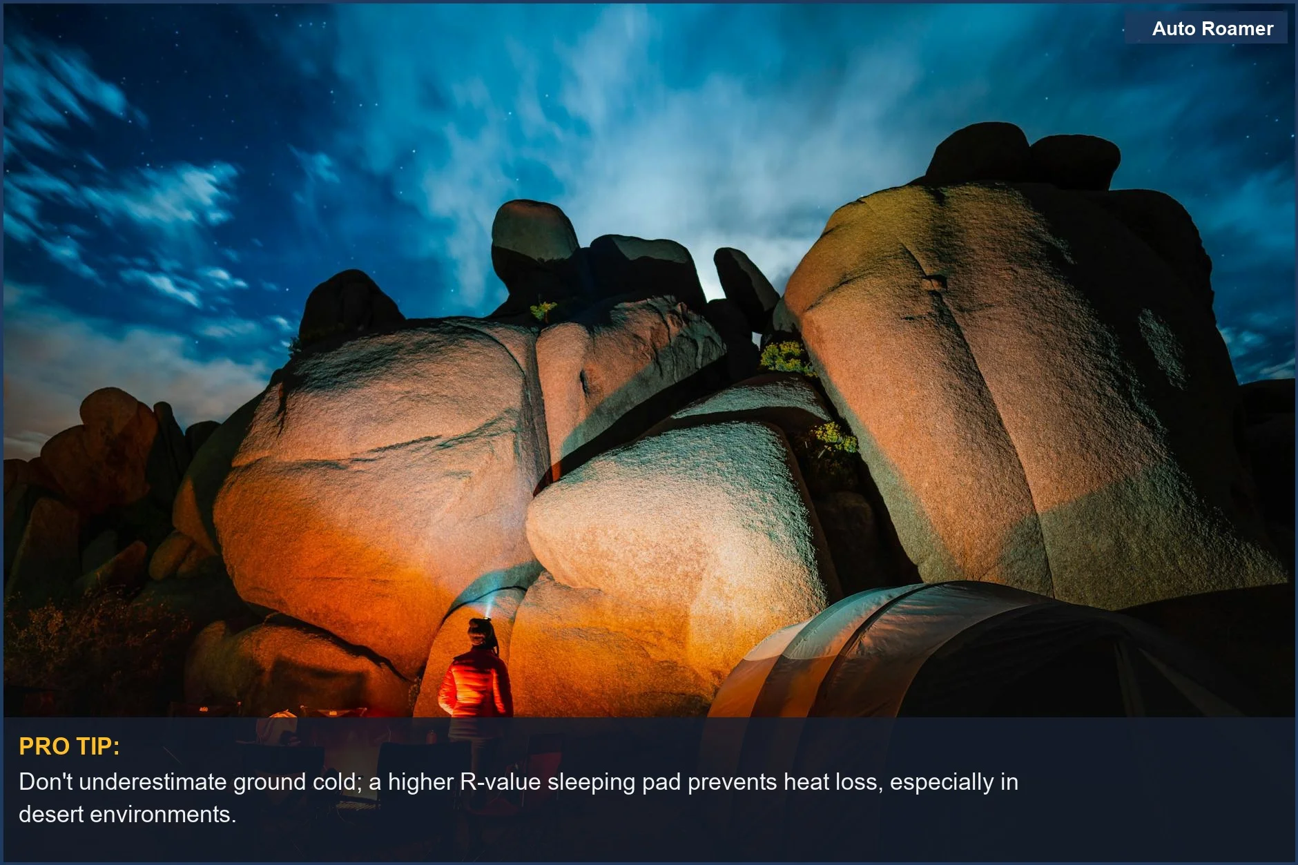Starry night campsite with tent and rock formations, illustrating the need for cold weather sleeping pad R-value.
