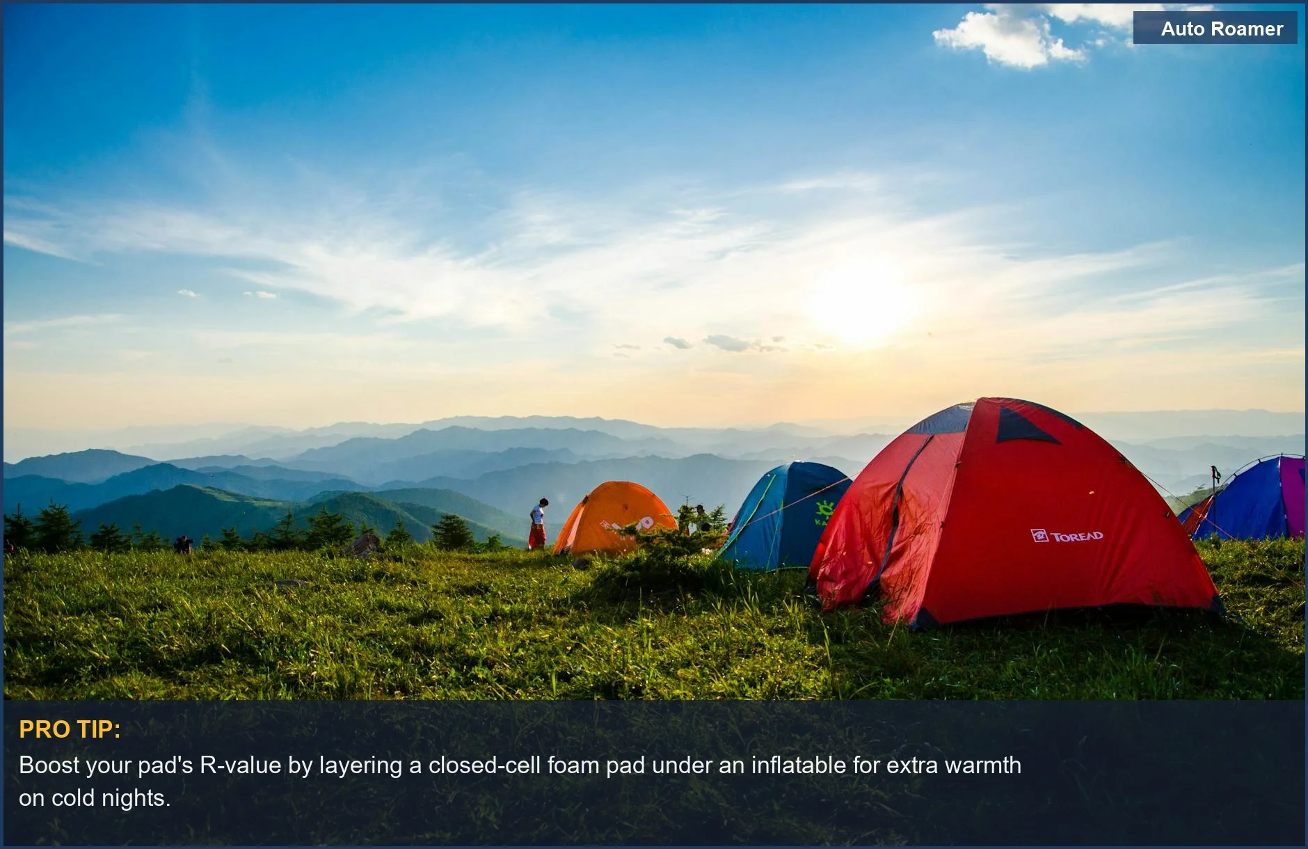 Sunrise over mountain ridge with tents, illustrating car camping insulation needs for cooler weather.