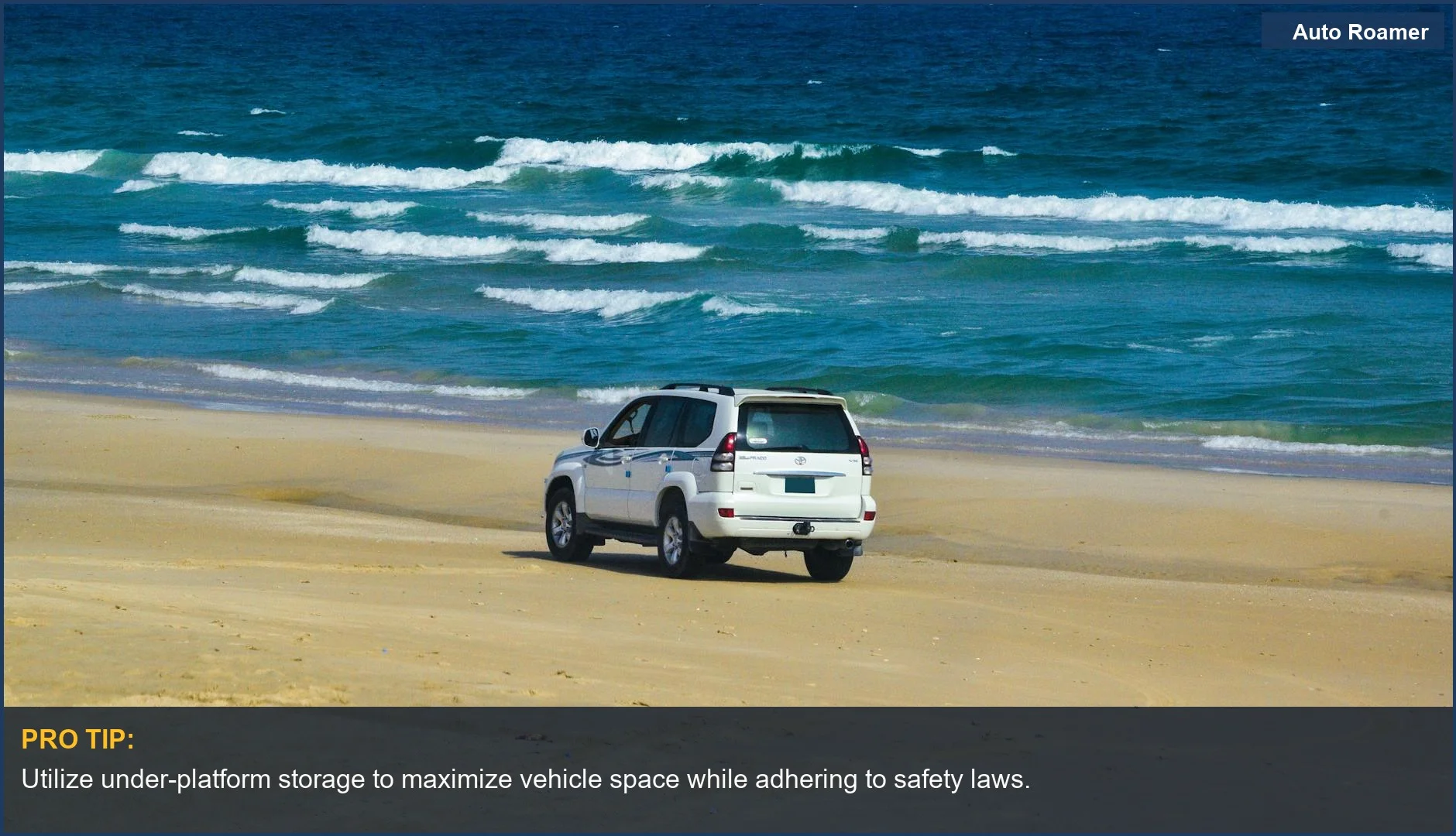 SUV driving on a sandy beach, showcasing travel and compliance with reverse camera regulations.