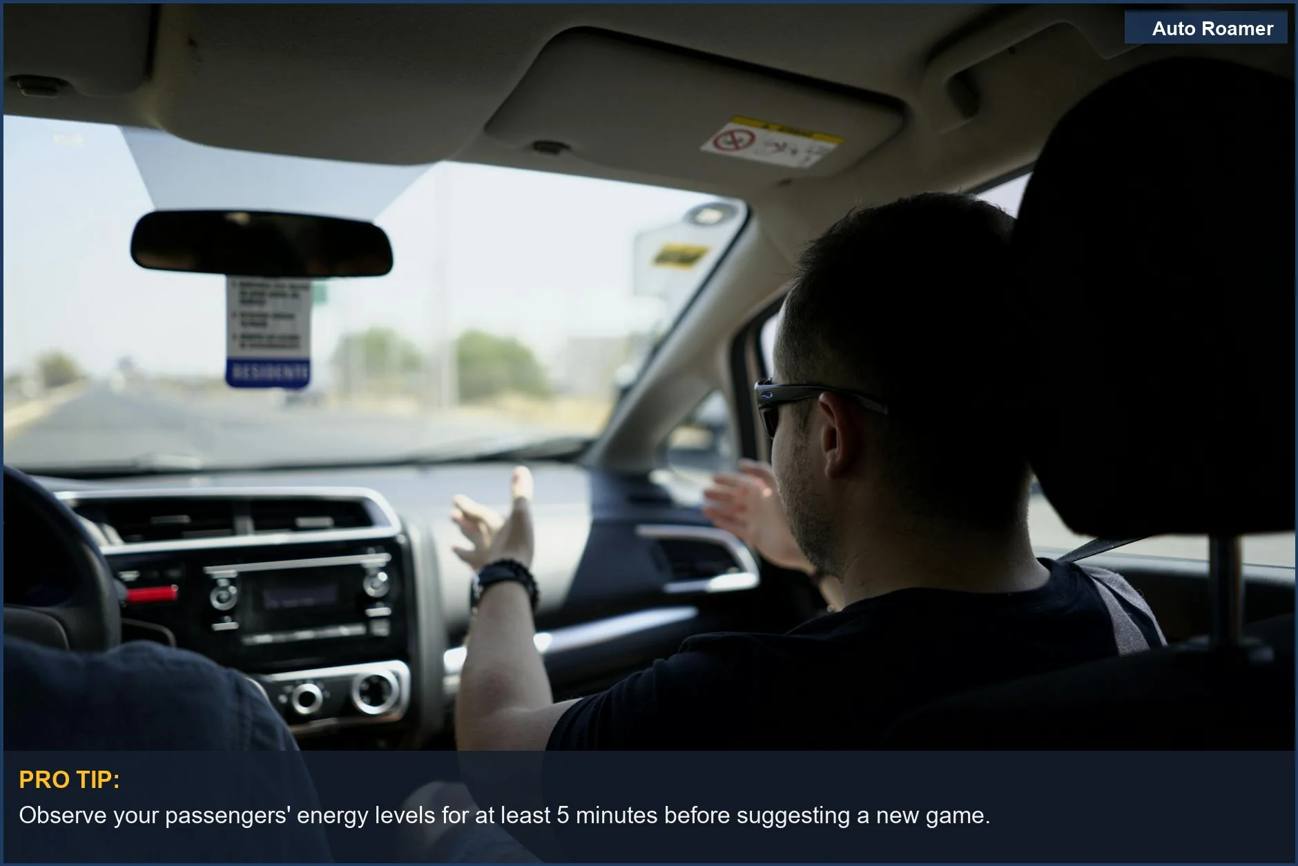 Passenger gesturing while talking on a sunny day, highlighting conversation in adult road trip games.