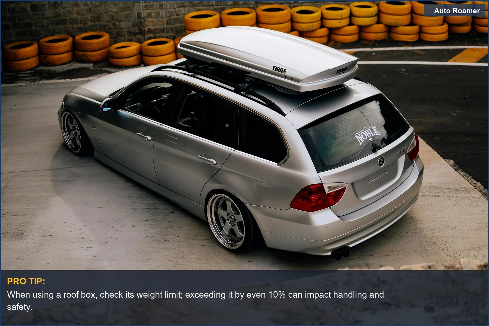 Sleek silver wagon with a roof box, demonstrating advanced road trip storage options.