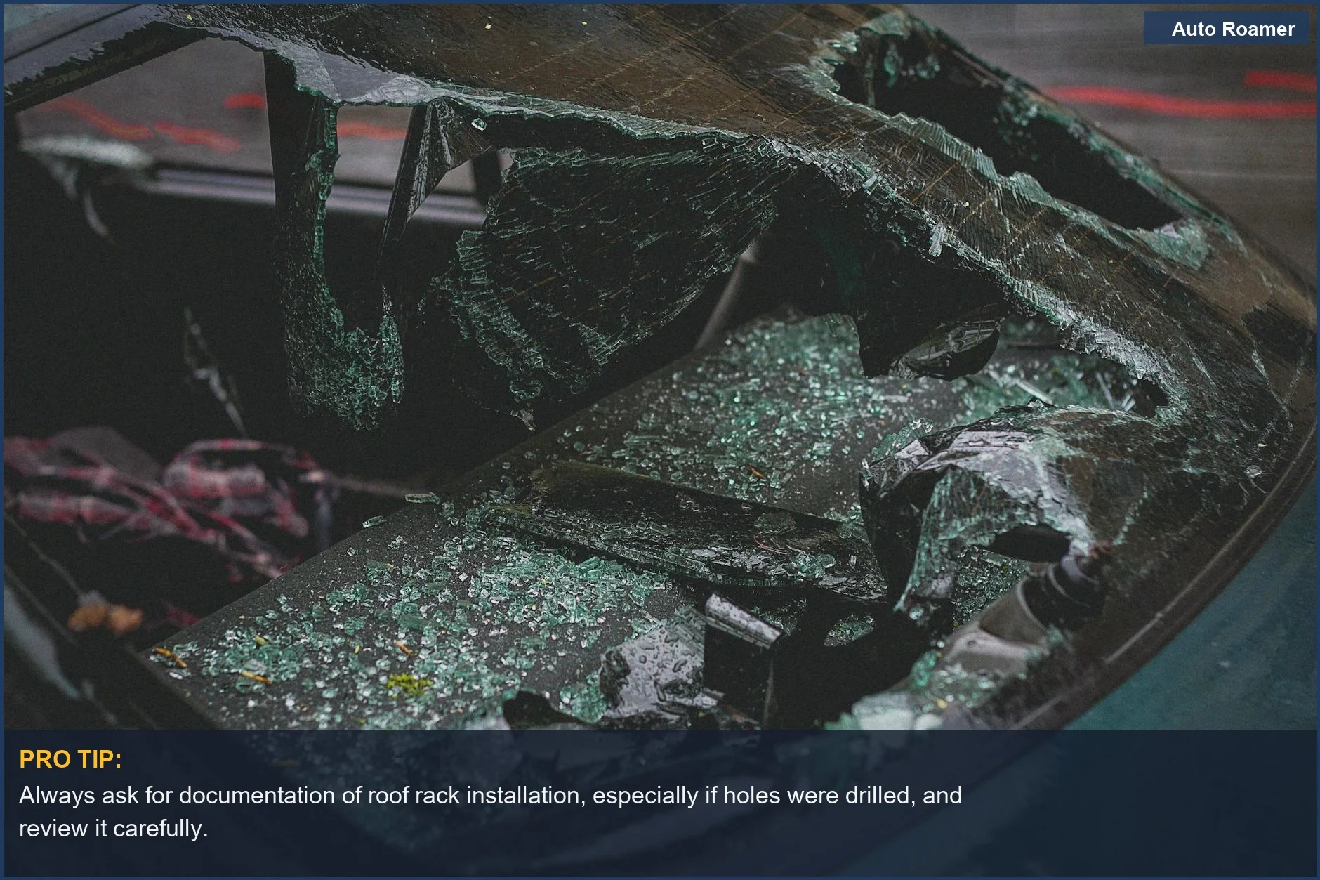 Shattered car windshield with broken glass, a visual representation of accident consequences and potential structural compromise.