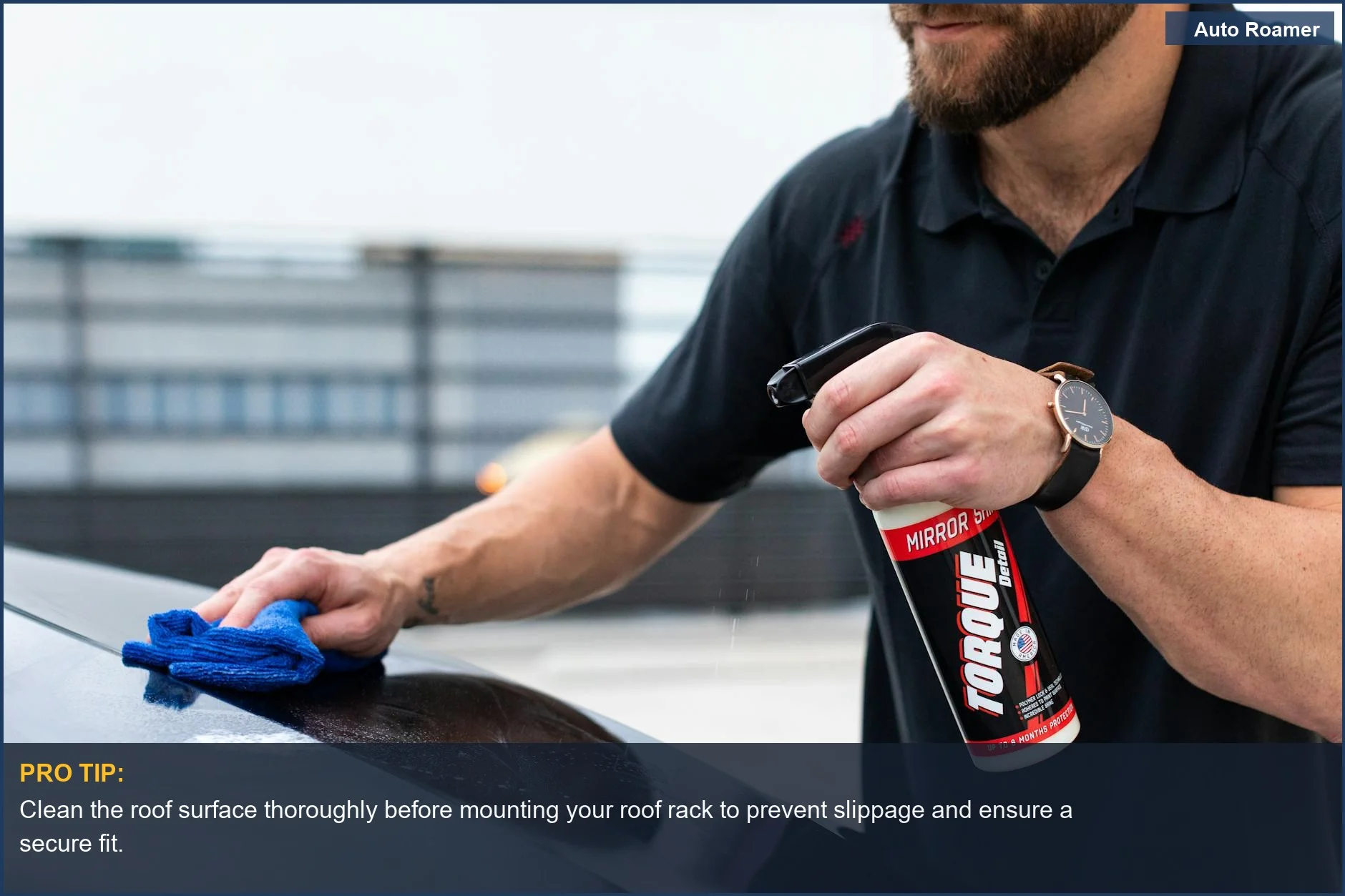 Man meticulously cleaning car roof for secure roof rack installation, ensuring a strong grip.