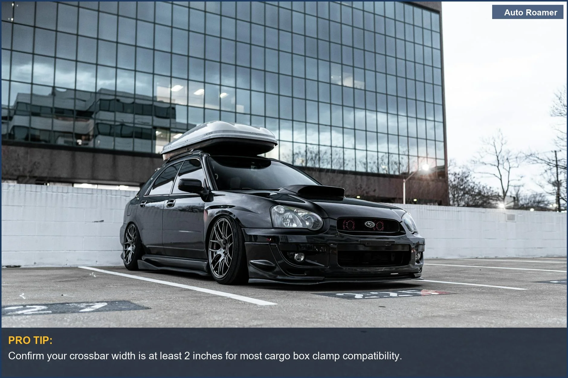 Urban black car with a roof rack system, essential for mounting a cargo box securely.