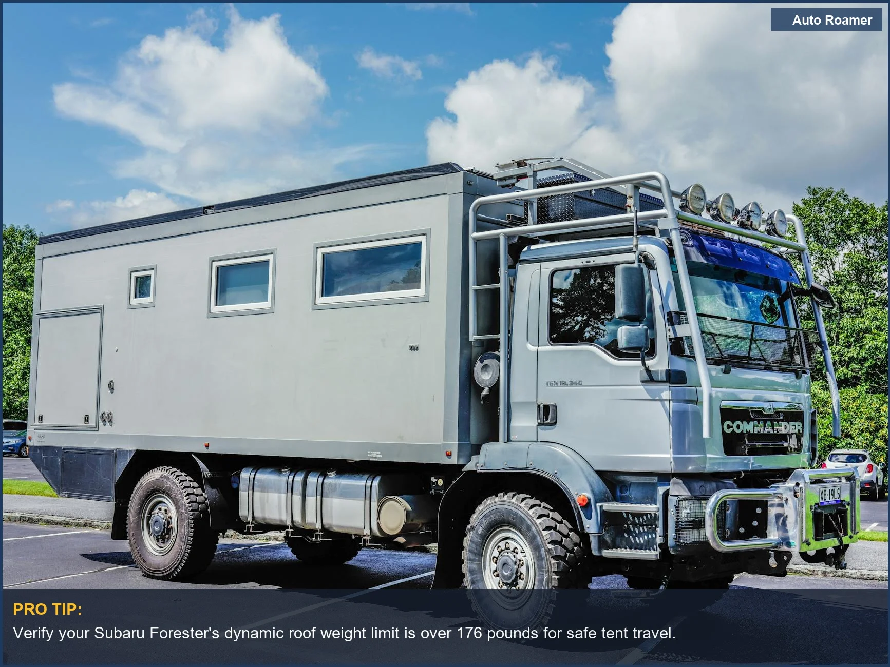 White Kia Soul with roof box, illustrating vehicle compatibility considerations for rooftop tents.