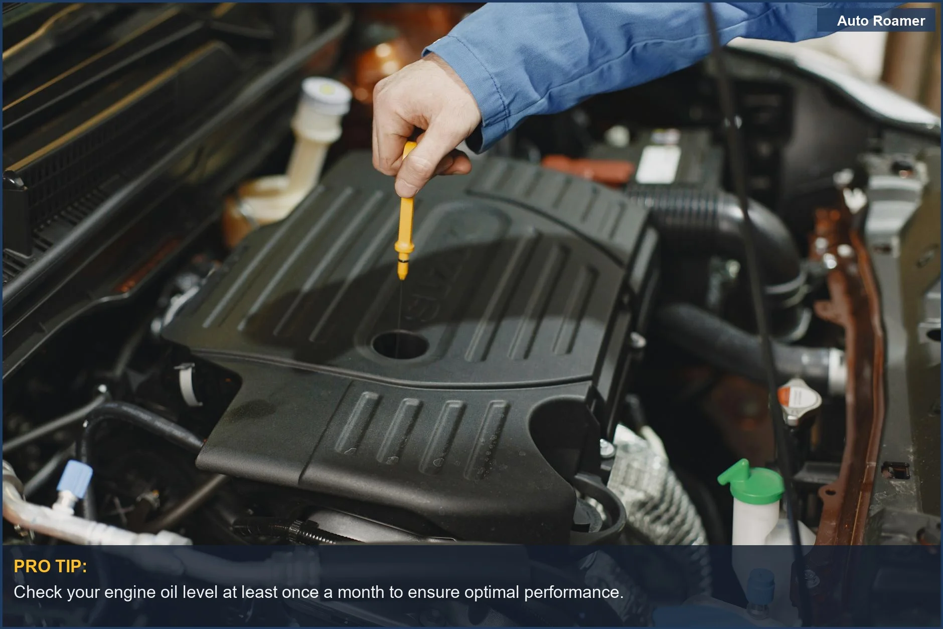 Person checking car engine oil level with a dipstick, a crucial step for vehicle upkeep.