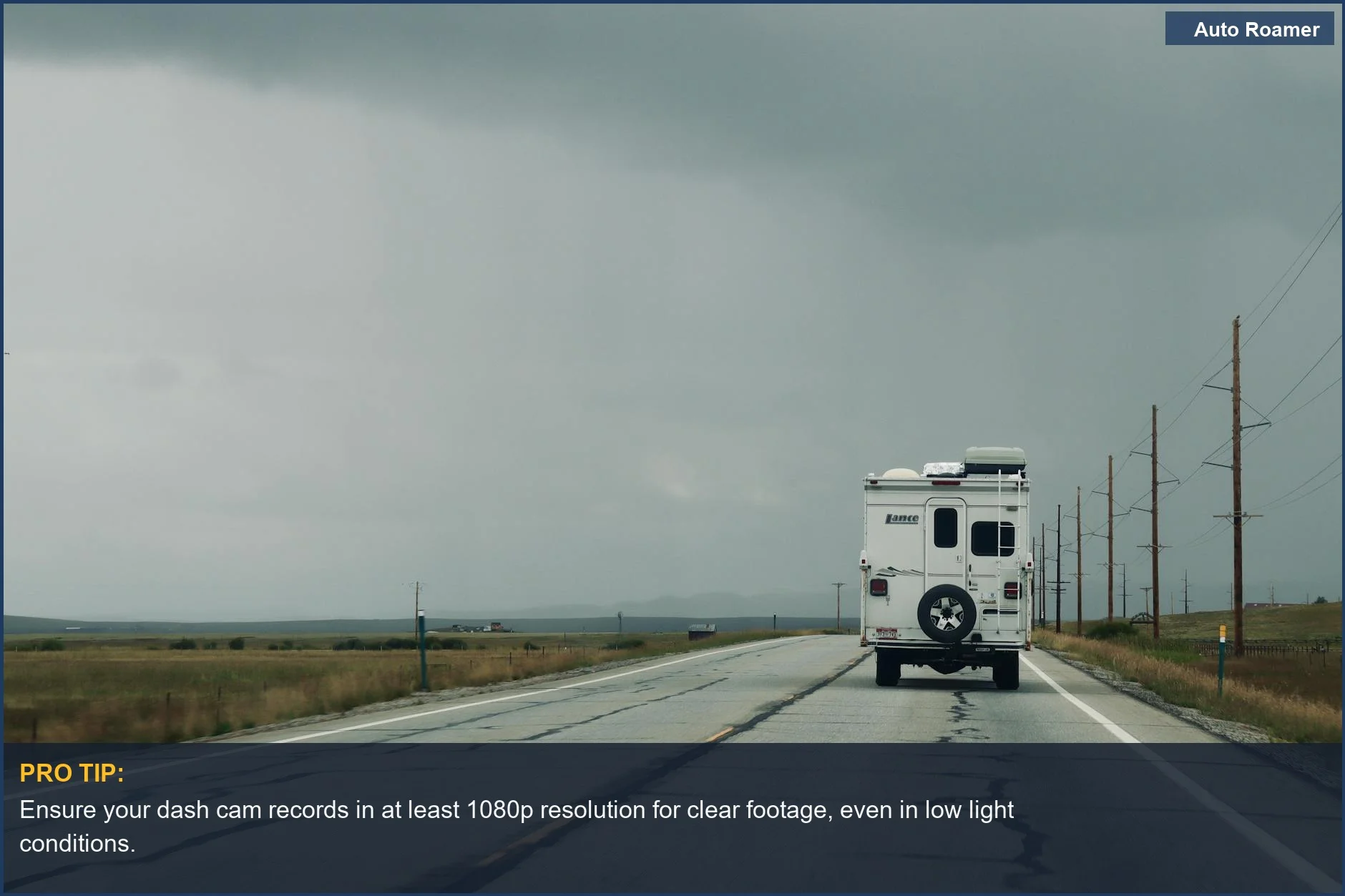 Lone motorhome on a rural highway under cloudy skies, illustrating motorhome camera requirements.