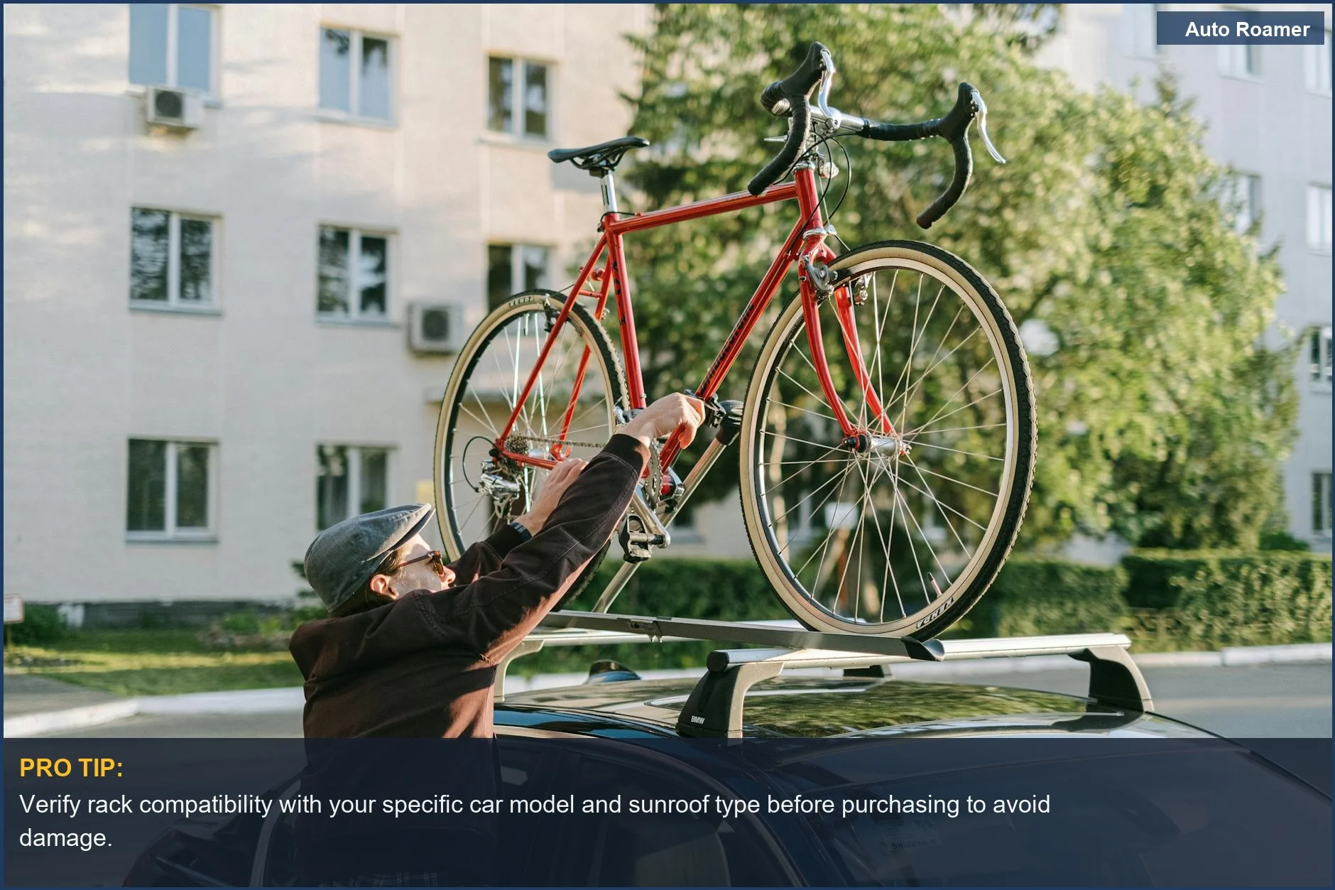 Man securely attaches a red bicycle to a car roof rack, ensuring safe DIY roof rack installation.