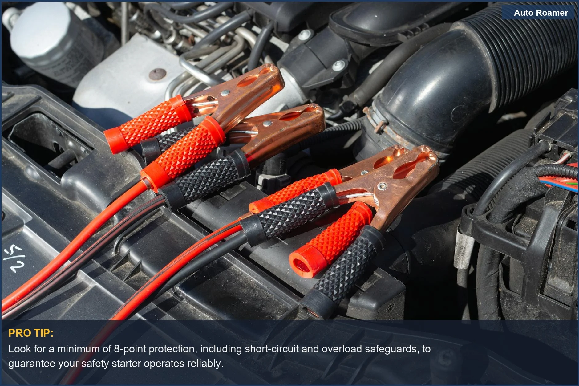 Close-up view of jump starter cables connected to a car battery terminal, showcasing critical jump starter protection mechanisms.