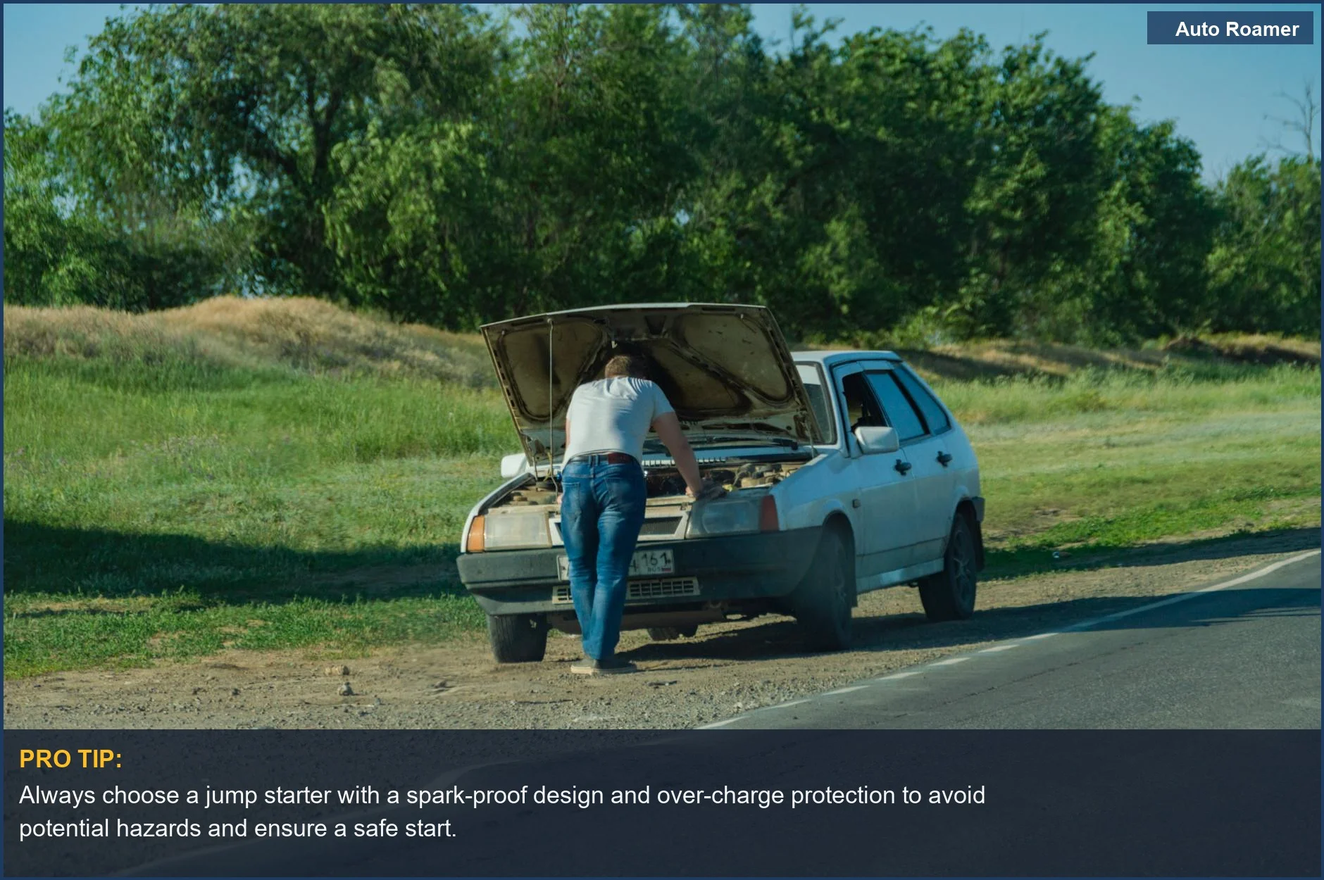 Man stranded by car on roadside, emphasizing the need for a safe car starter in emergencies.