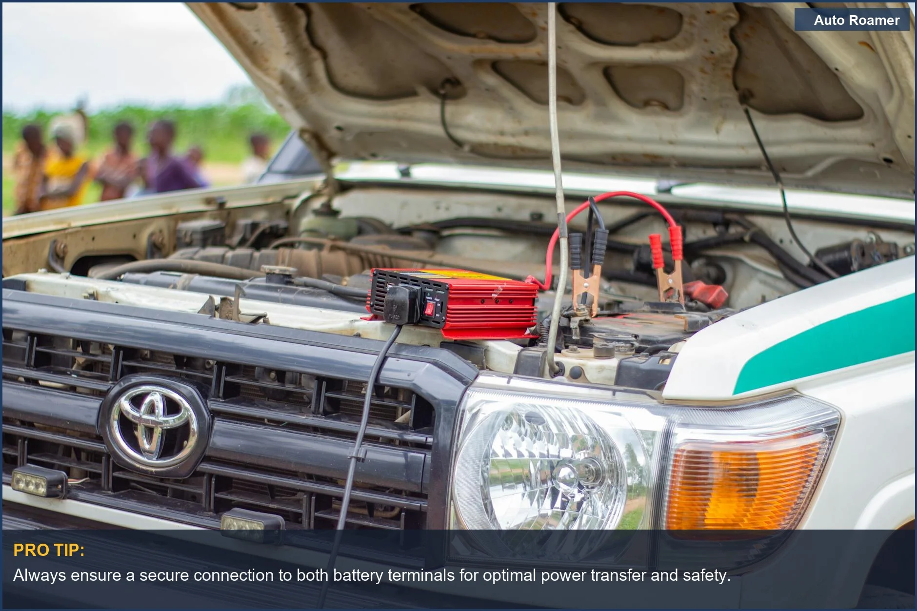 Close-up of a car battery terminal with a jump starter cable attached, illustrating jump starter safety precautions.