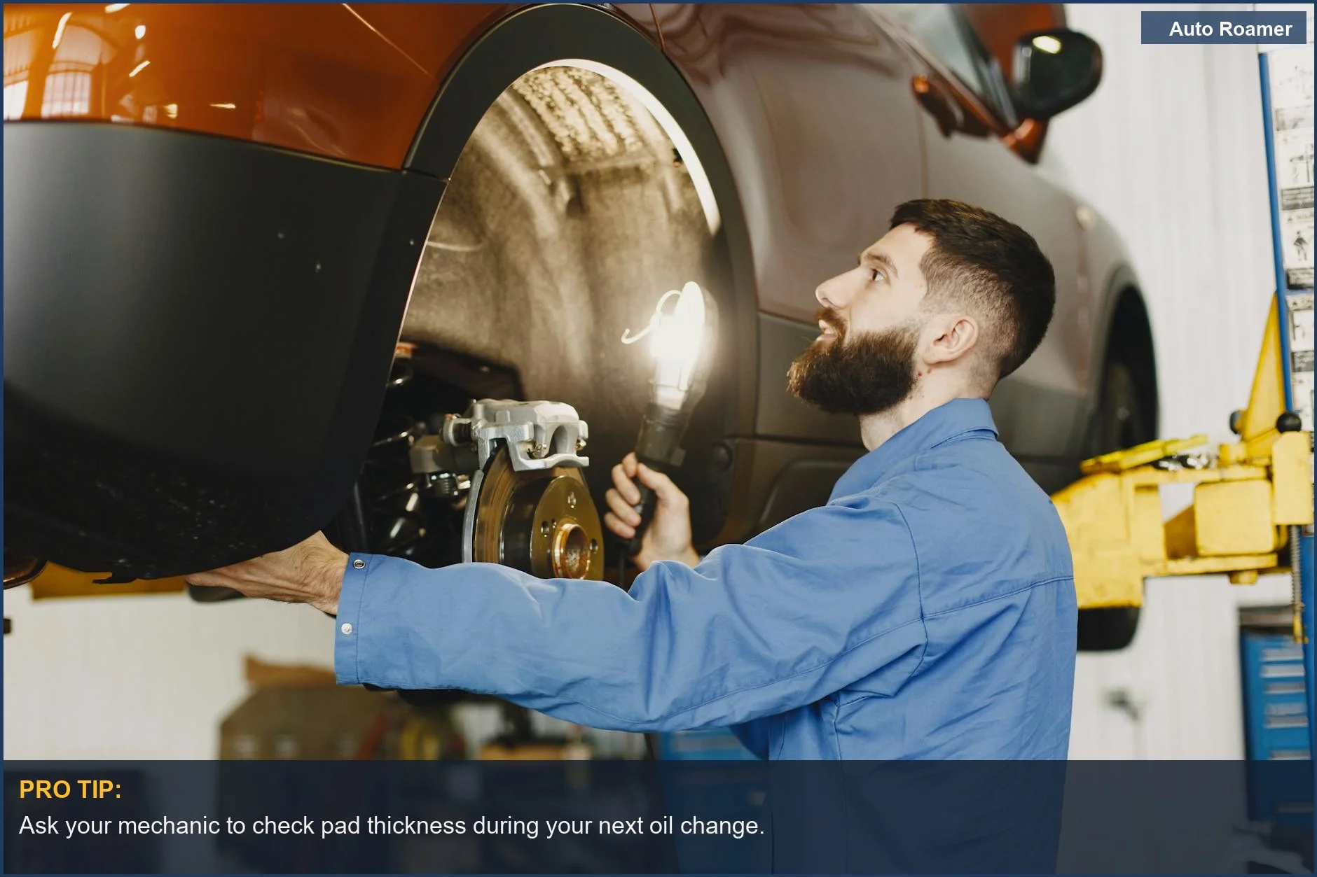 Mechanic examines car brakes, a visual cue for checking worn brake pads.