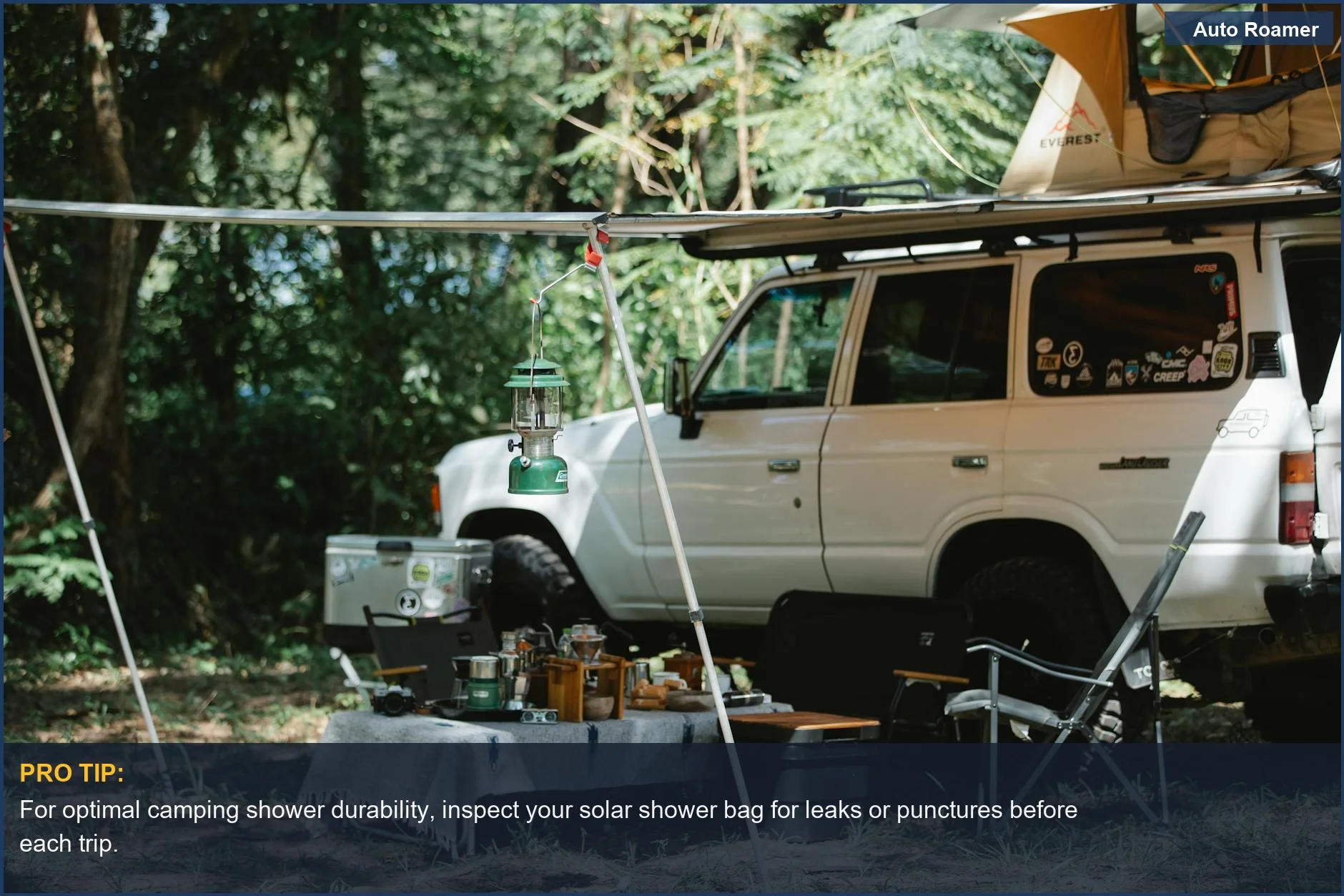 Camper with a rooftop tent and awning camping in nature, showcasing the ruggedness of camping shower durability.