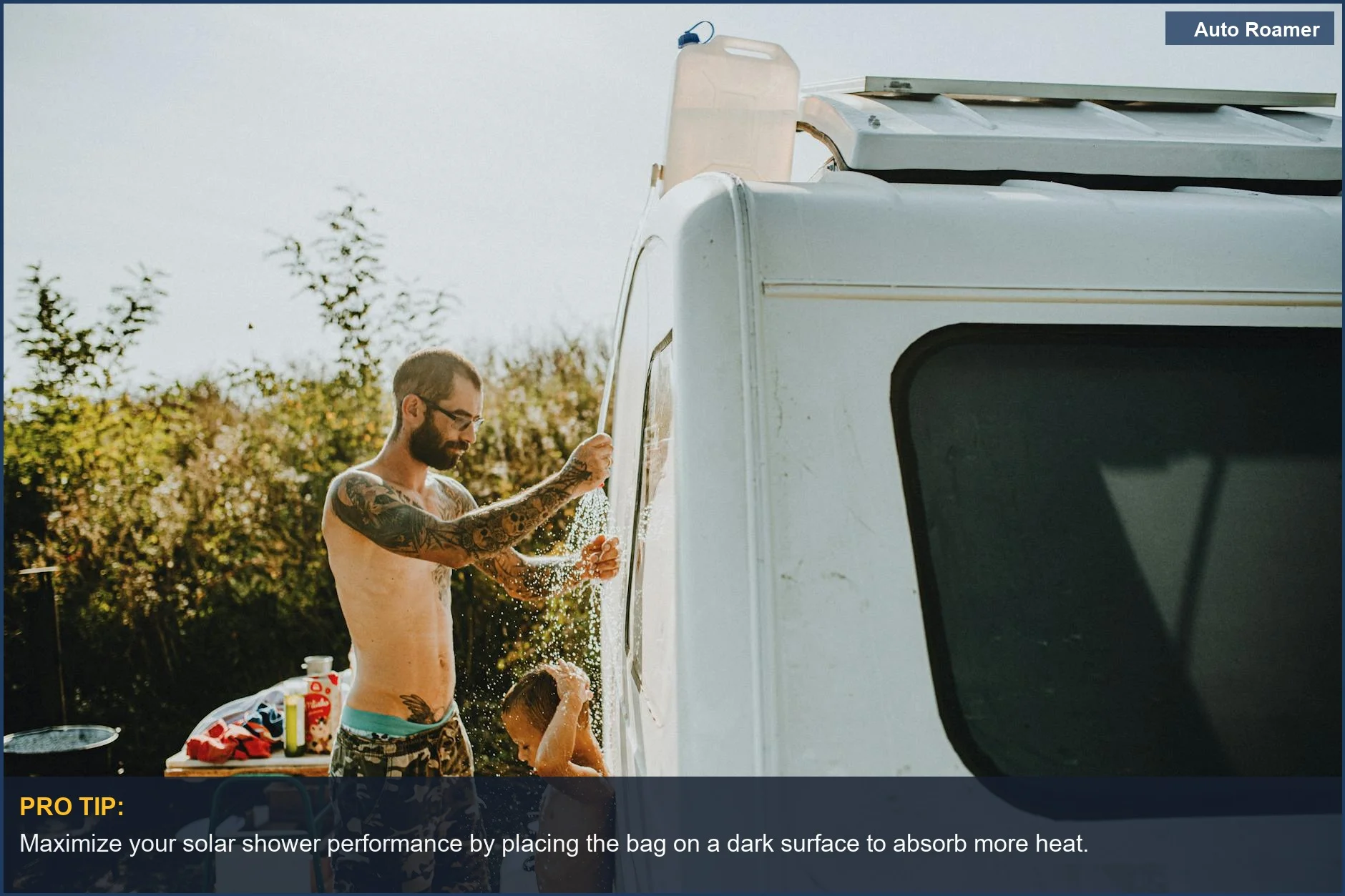 Father and son enjoying a refreshing solar shower near a campervan, illustrating outdoor camping shower durability.