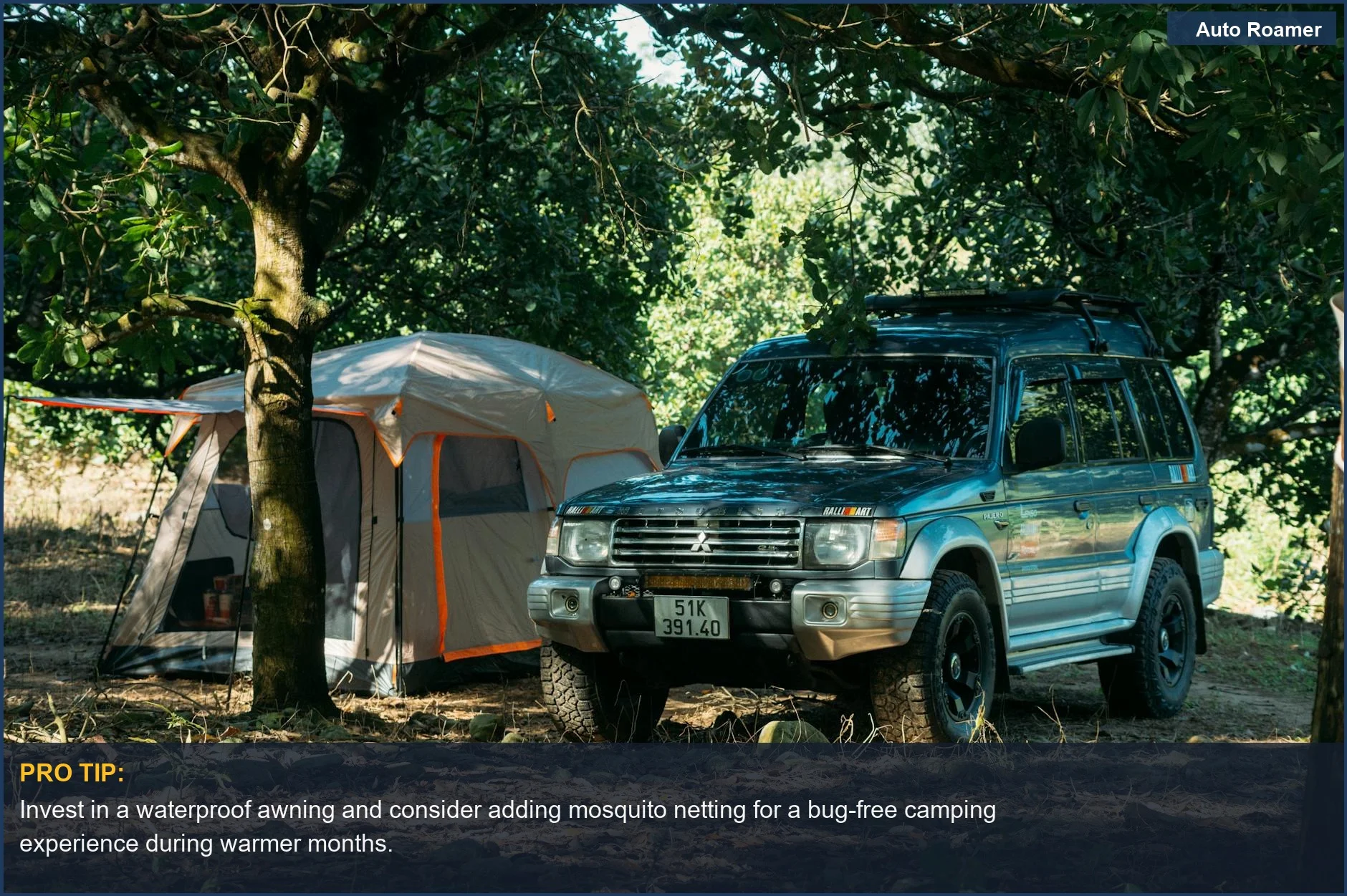 SUV parked in a forest next to a tent, demonstrating SUV awning setup possibilities.