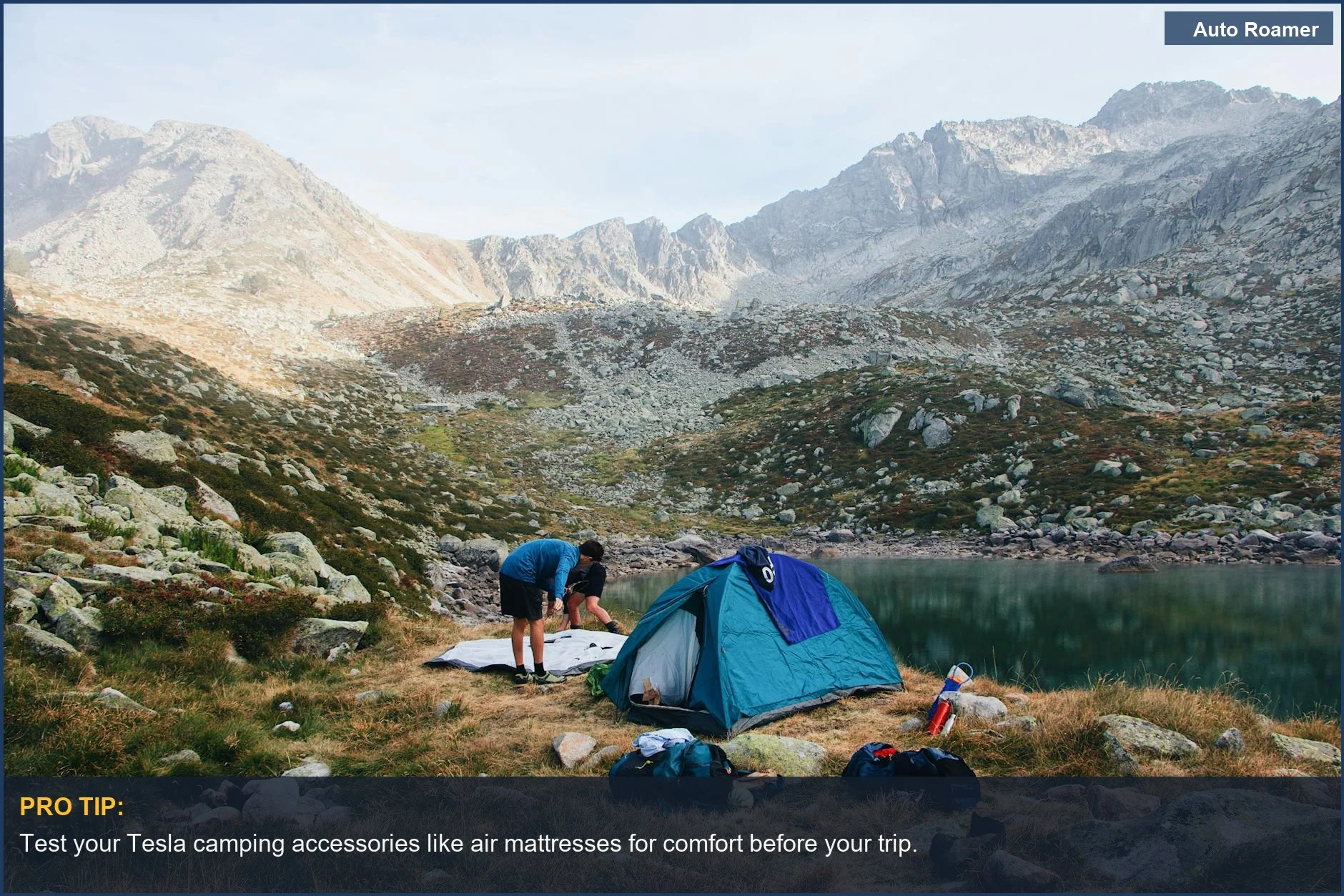 Stunning view of a camping site by a lake with a Tesla Model 3 nearby.