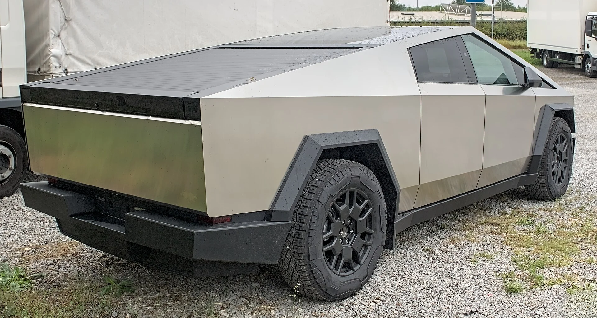 A stainless 2024 Tesla Cybertruck Foundation Series in a front three-quarter view, the electric truck whose climate and comfort are discussed for camping.