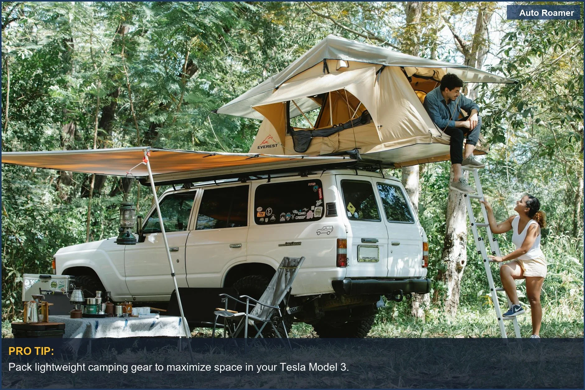 Couple enjoying nature with Tesla Model 3 camping gear in a forest with a rooftop tent.