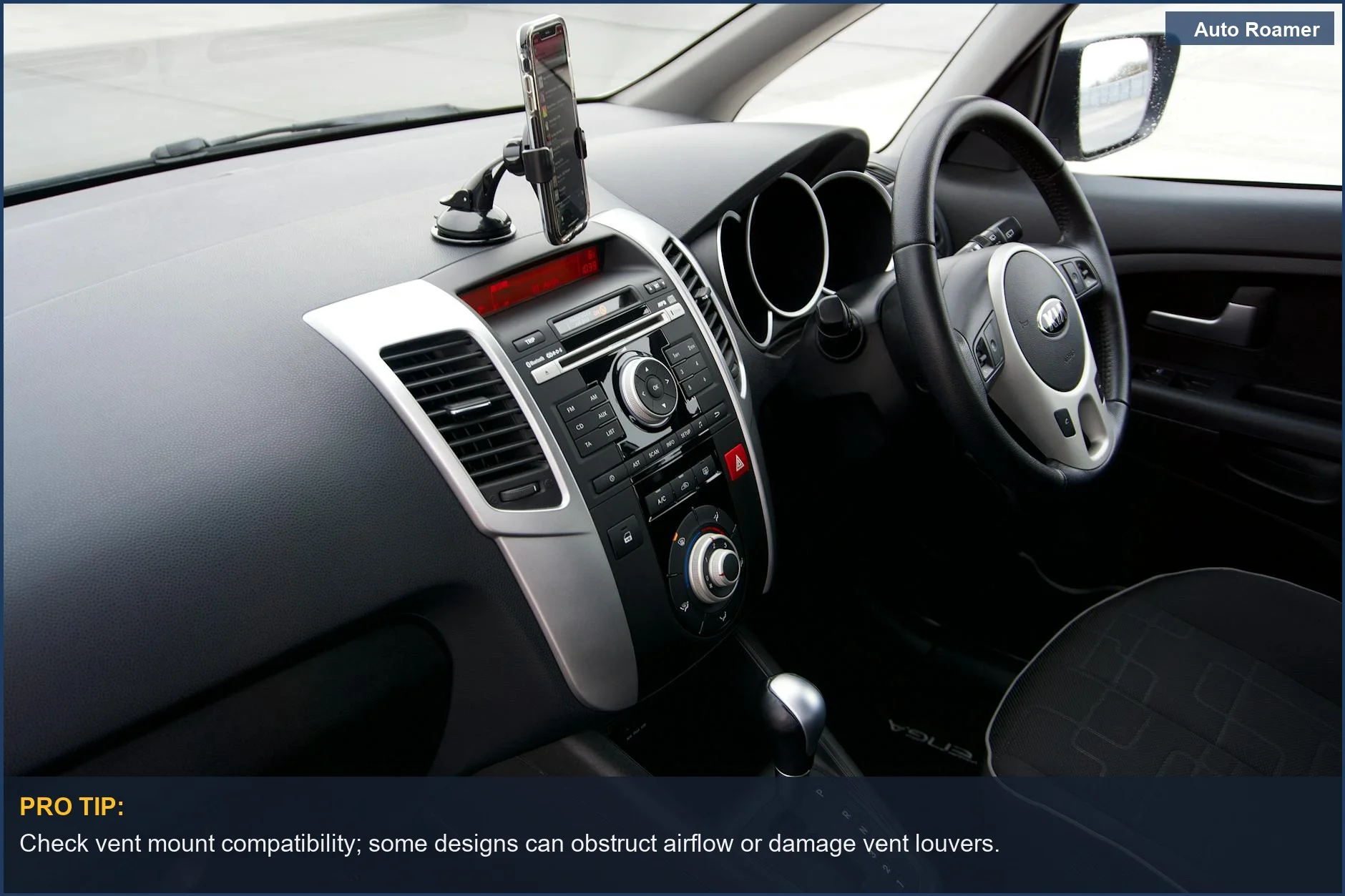 Close-up of a Tesla Model 3 air vent with a smartphone securely clipped into a vent mount.