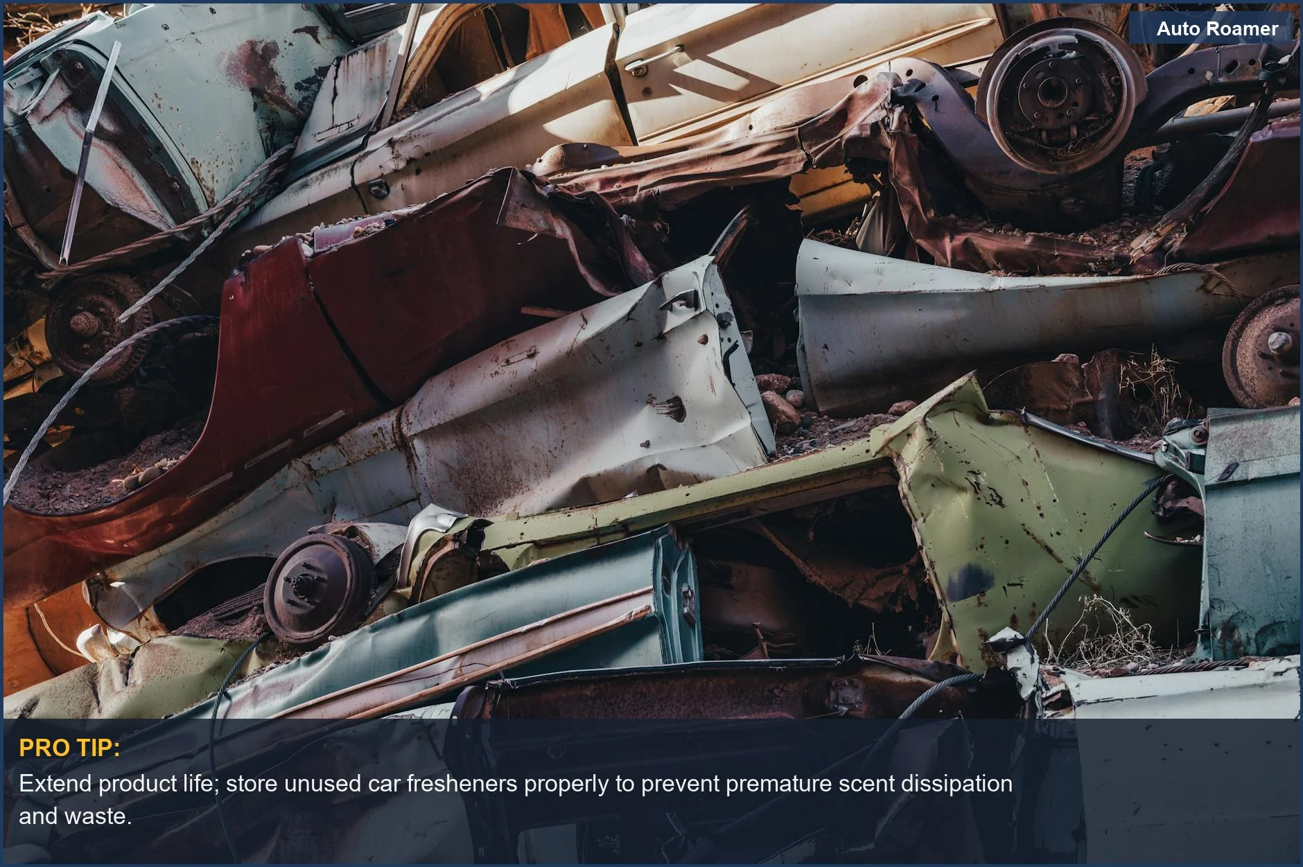 Close-up of stacked, rusted cars in a junkyard, showcasing the impact of automotive waste.