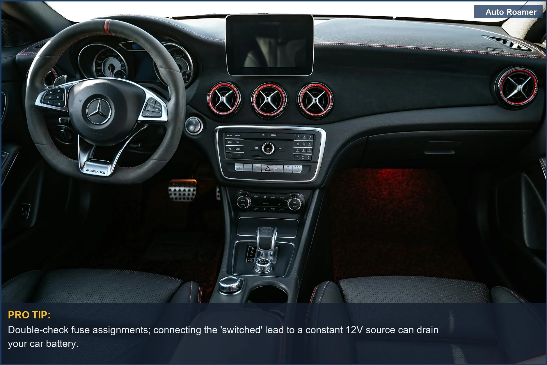 Luxury car interior with a detailed dashboard and steering wheel, showcasing advanced vehicle electronics.