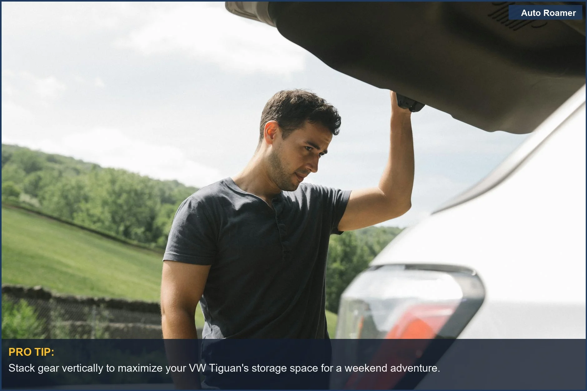 Man organizing Tiguan car camping gear in open trunk with scenic green background.