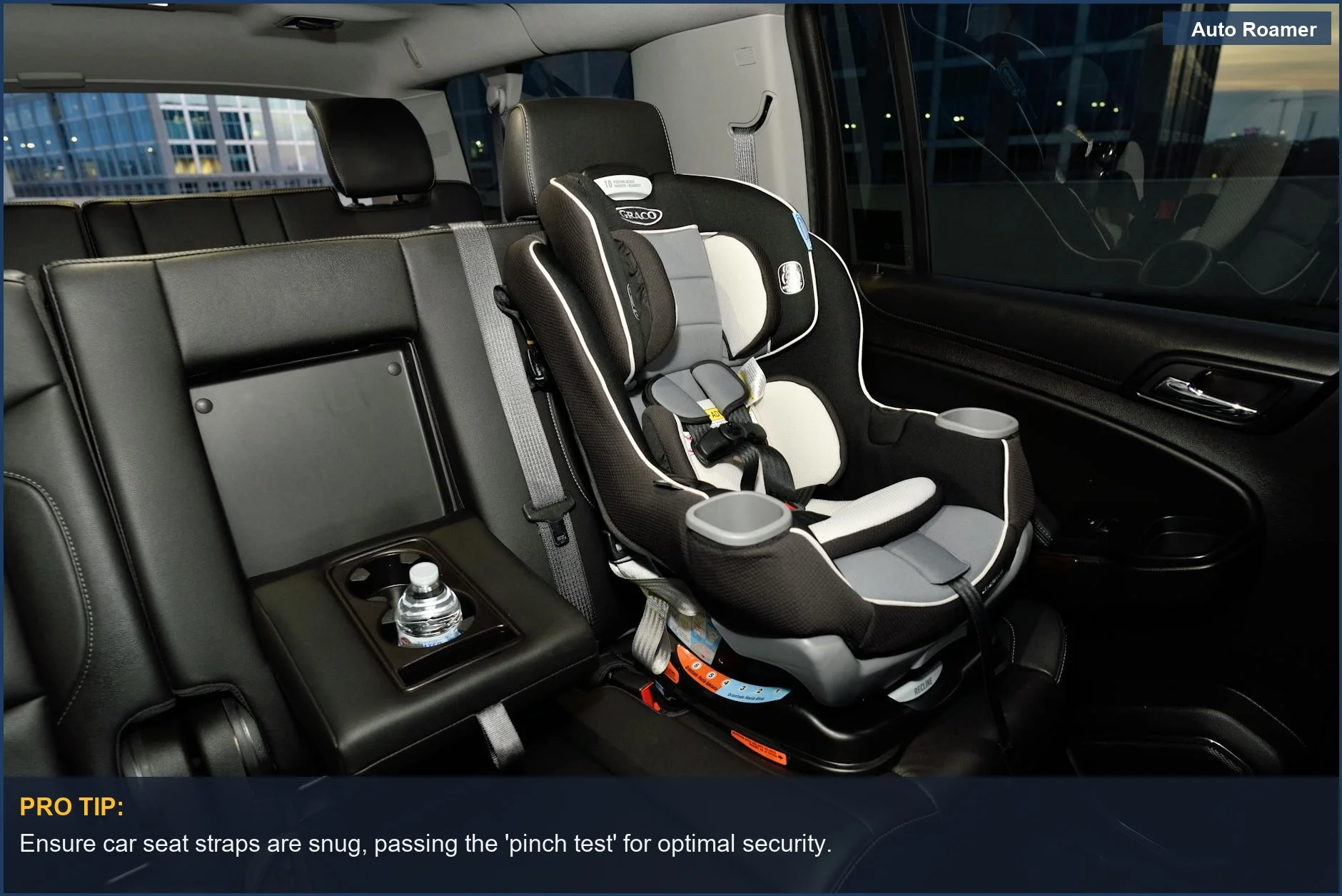 Modern car seat safely installed in a vehicle, crucial for child travel safety on family road trips.