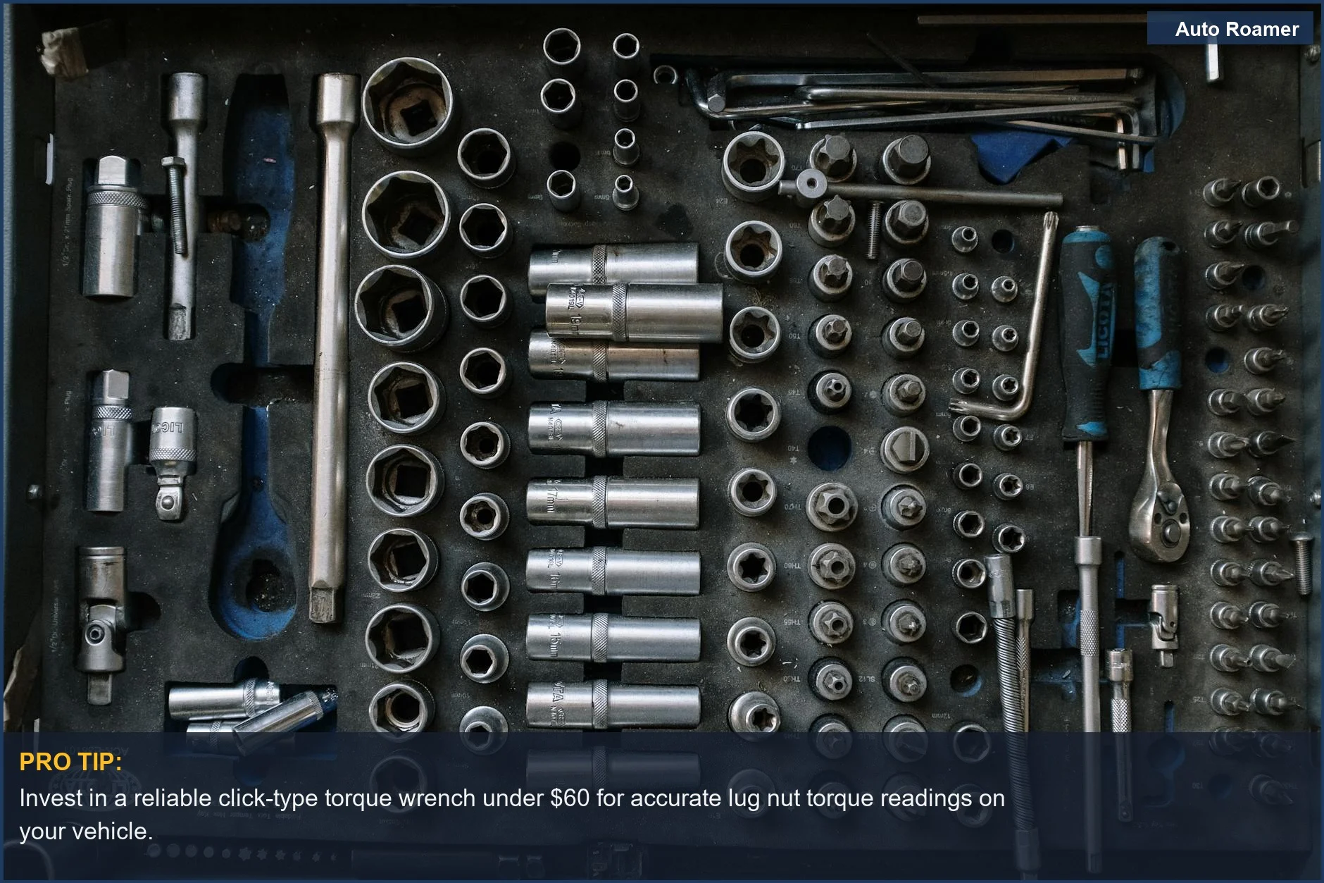 Organized toolset in a workshop, featuring a torque wrench essential for accurate lug nut torque measurements.