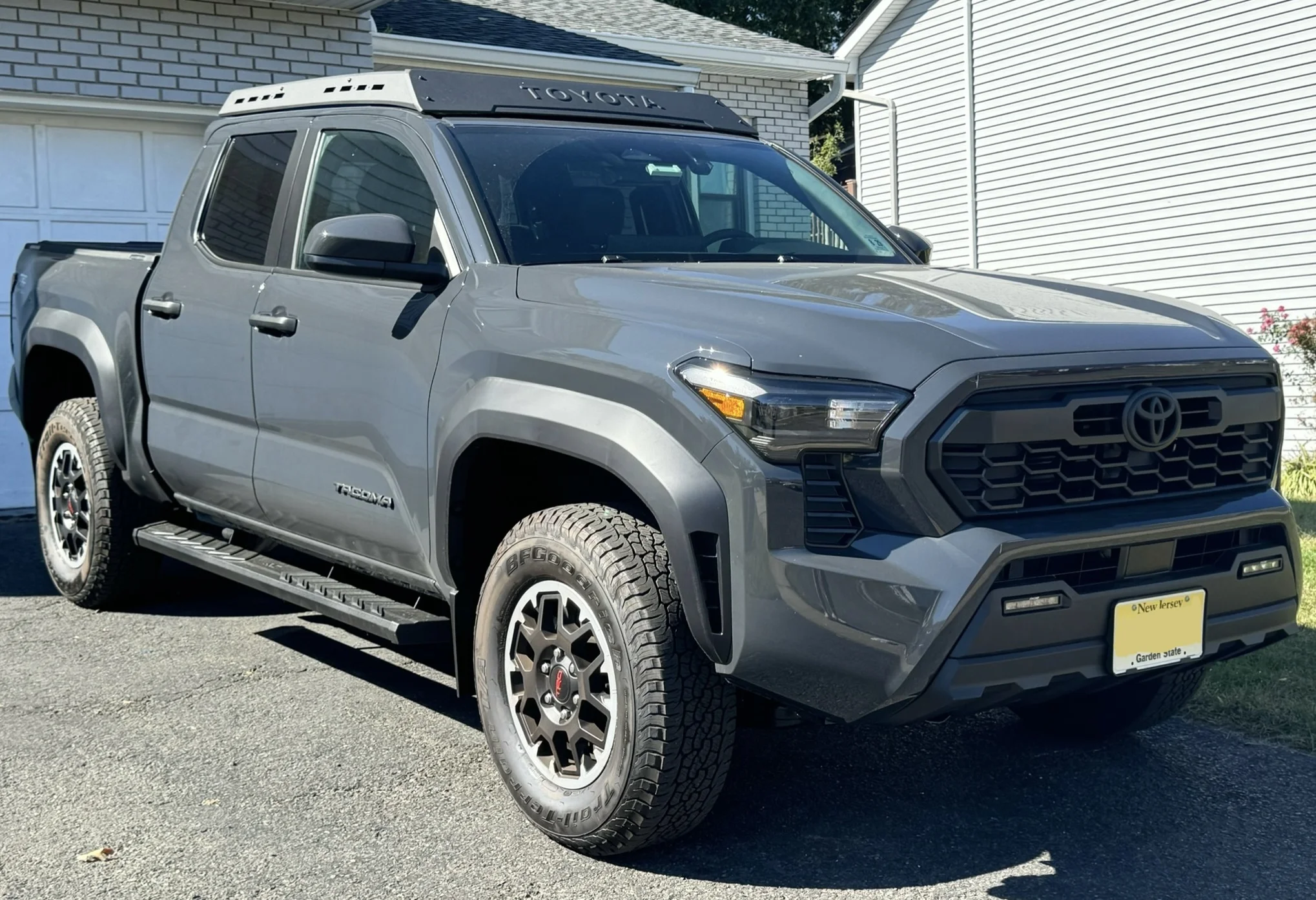 A 2024 Toyota Tacoma TRD Off-Road (fourth generation), the midsize truck this camping guide builds a bed and galley around.