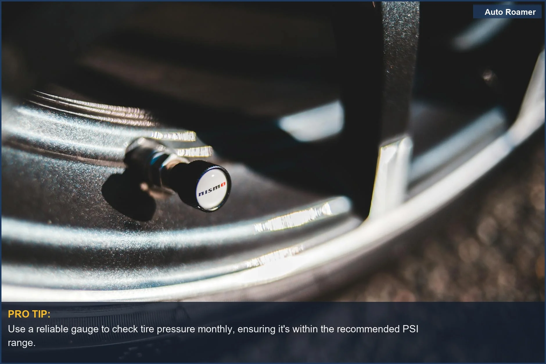 Detailed view of a car tire valve stem with NISMO branding, highlighting the importance of proper tire pressure.