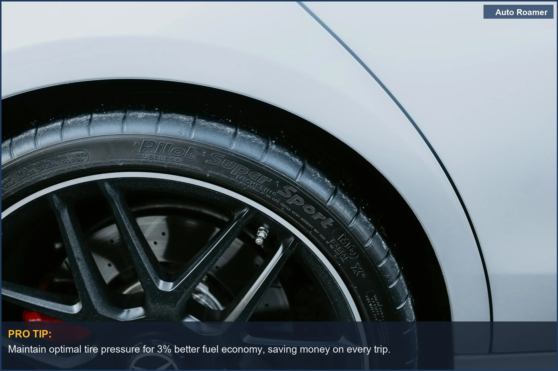 Close-up of a high-performance tire on a sleek alloy wheel, demonstrating fuel economy TPMS benefits.