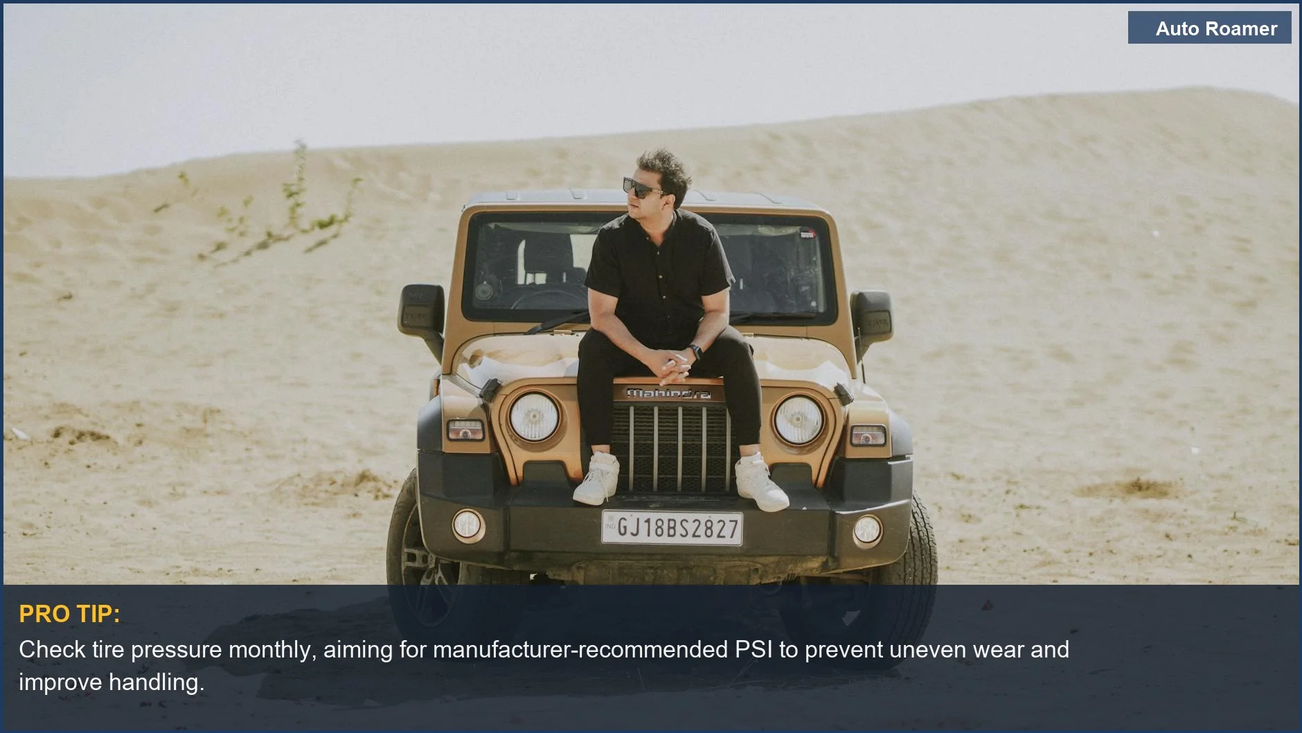 Man in sunglasses beside modern SUV in desert, highlighting the importance of tire pressure safety for vehicle control.