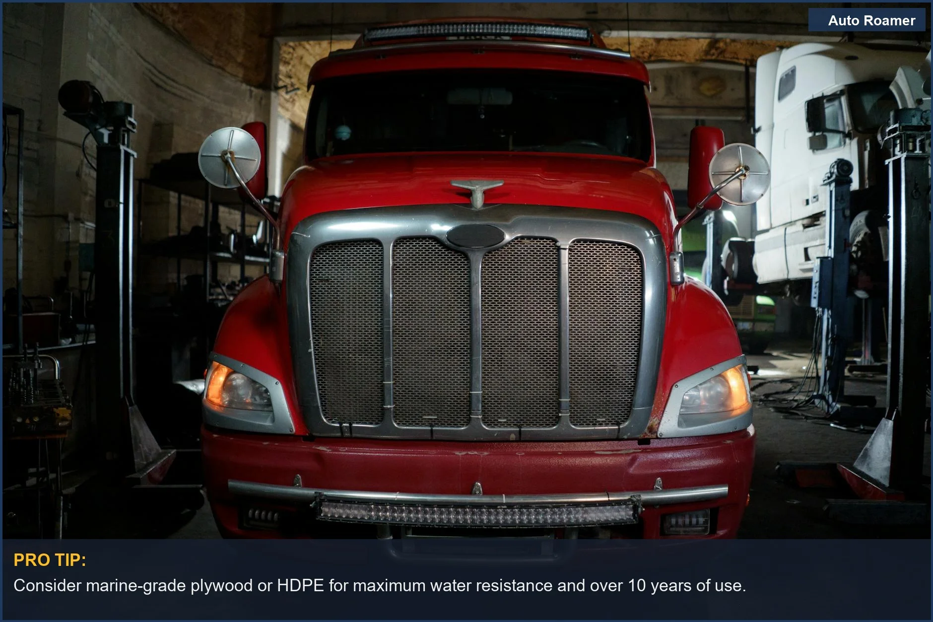 Red truck in dimly lit garage, emphasizing off-road durability in drawer materials.
