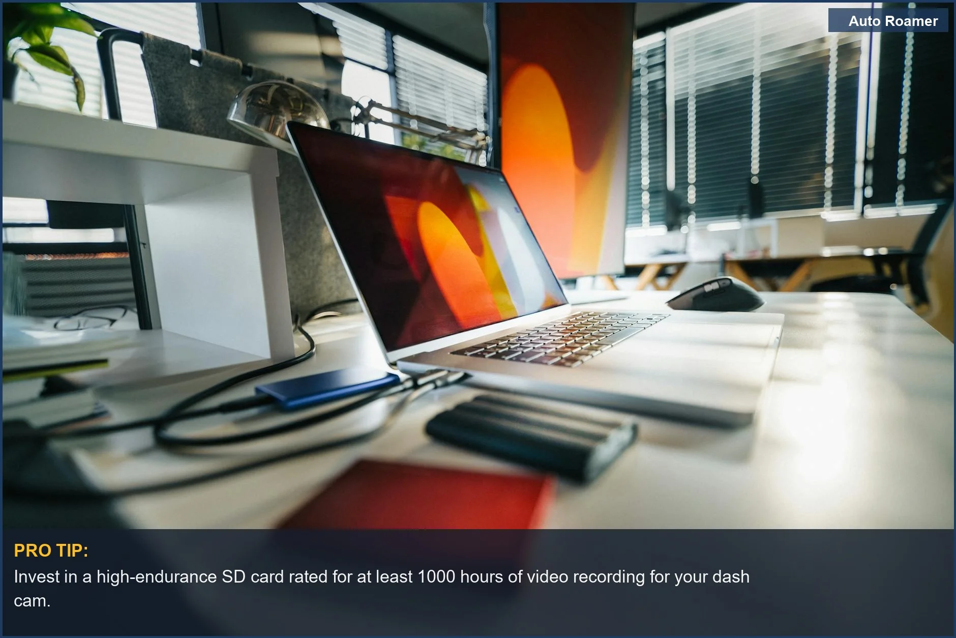 Modern truck driver's workspace with laptop and external drives, emphasizing dash cam SD card storage solutions.