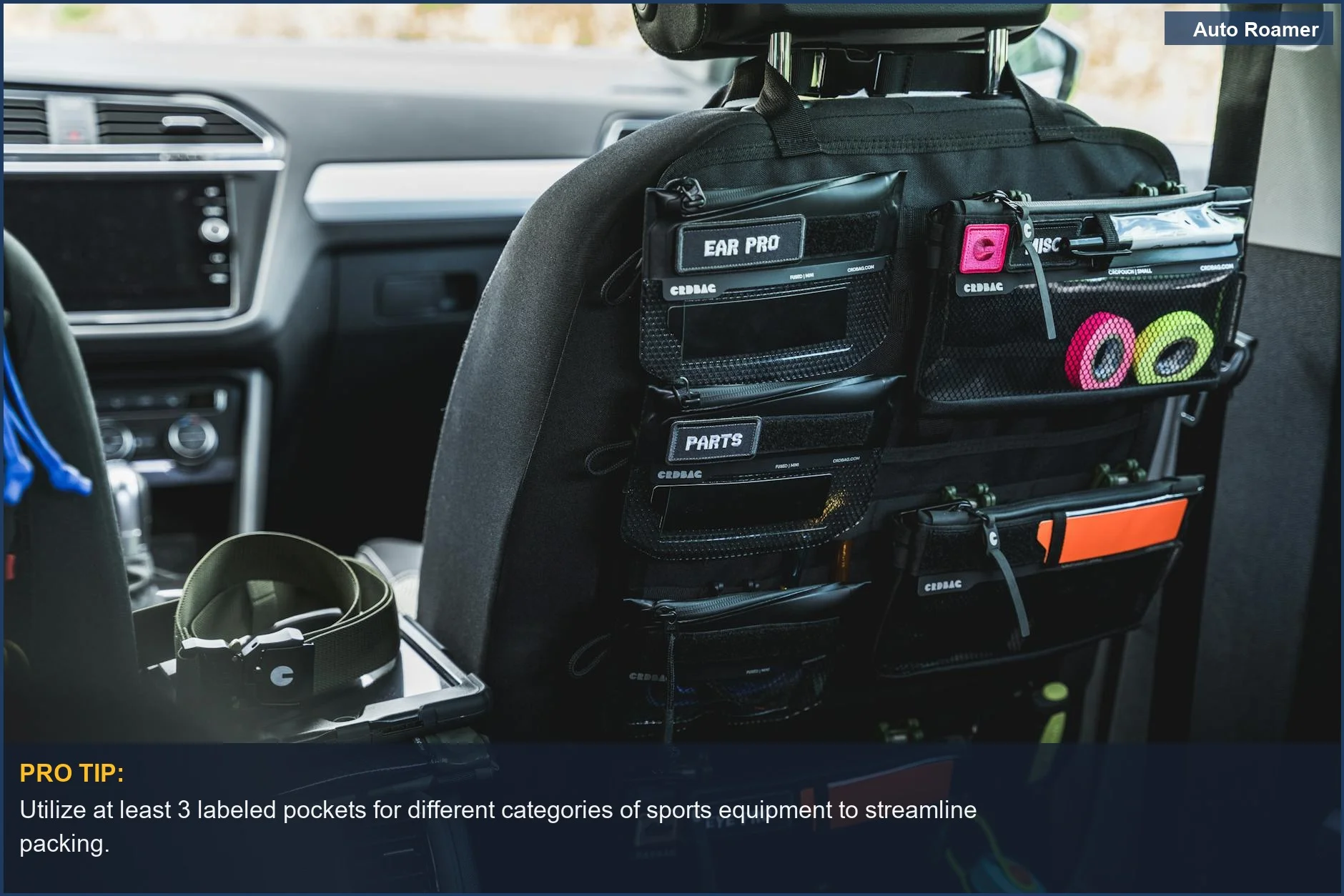 Car seat back organizer with labeled pockets for storing accessories and sports gear.