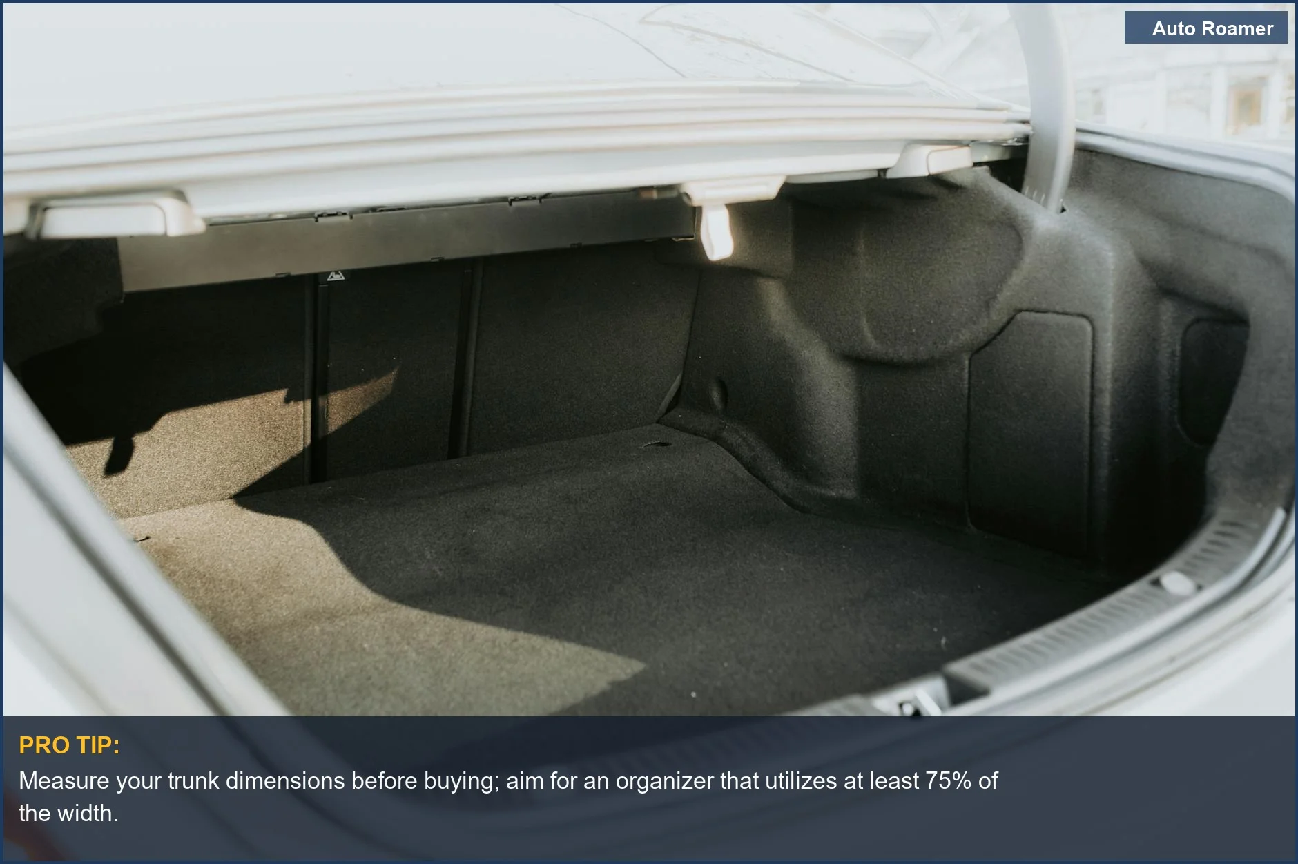 Empty car trunk with bright sunlight, showcasing ample space for sports equipment organizer.
