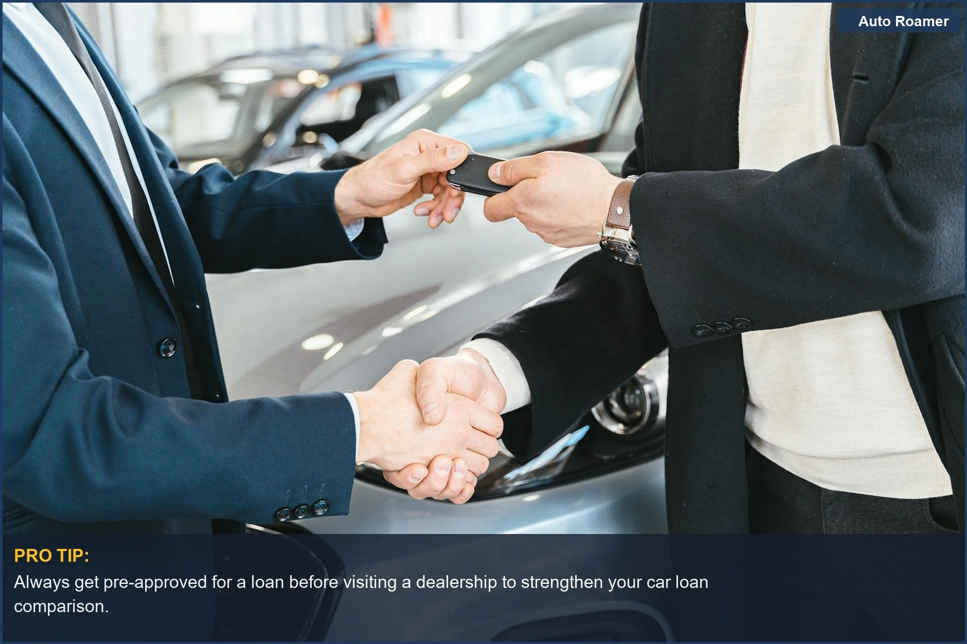 Businessmen shaking hands and exchanging car keys, signifying a successful car loan comparison.