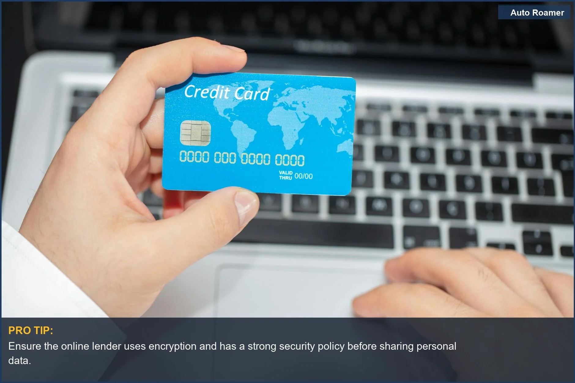 Person using credit card near laptop, illustrating secure online auto financing options.