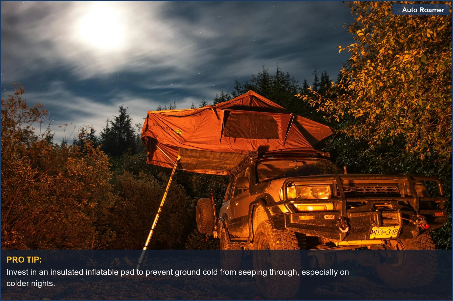 Jeep and rooftop tent under a starry night sky, illustrating the need for insulated pads for car camping comfort.