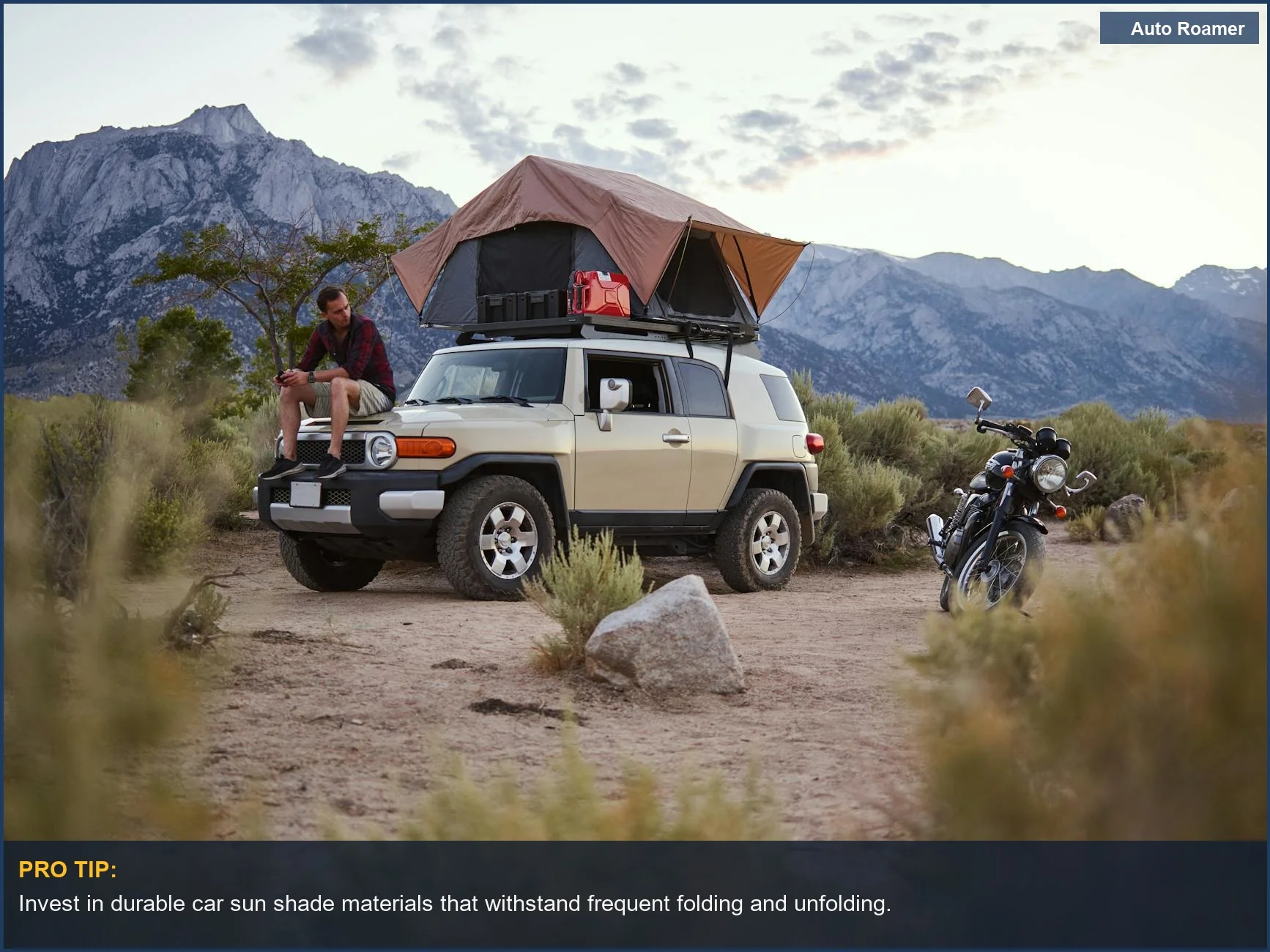 Man enjoying a mountain view with a rooftop tent on a car, highlighting the benefits of car sun shade materials.