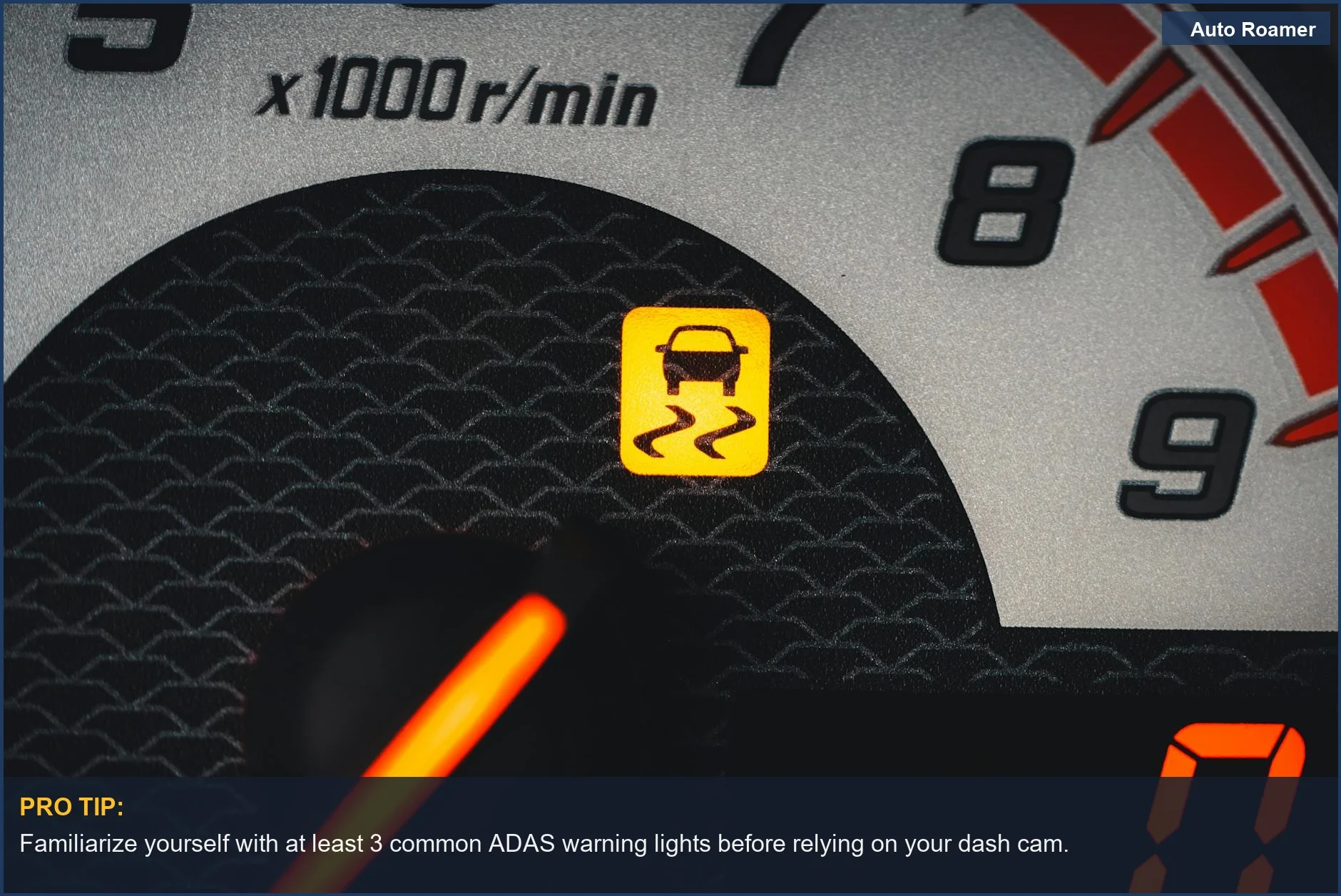 Car dashboard with illuminated ADAS dash cam warning light, signifying advanced driver assistance systems.