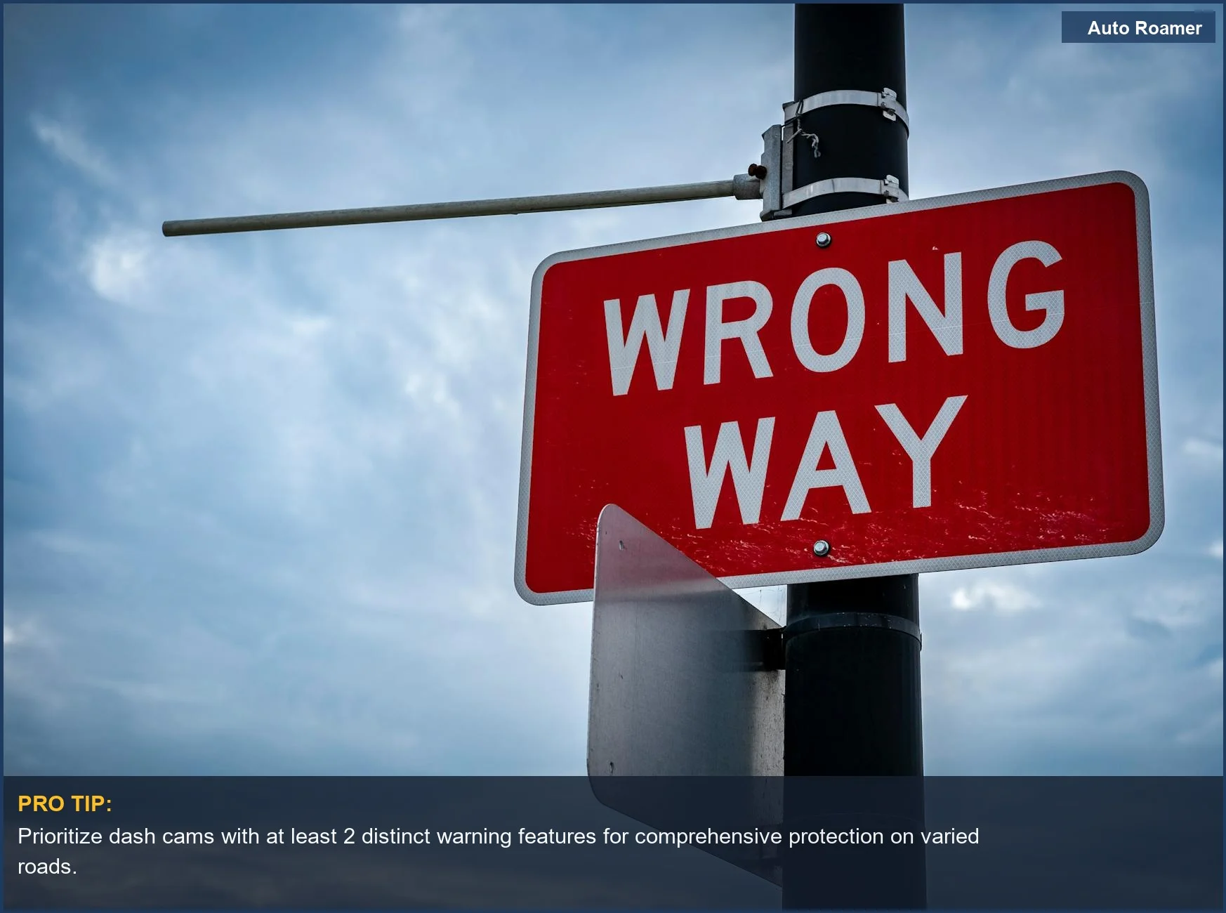 Red wrong way road sign against an overcast sky, representing a critical safety alert.